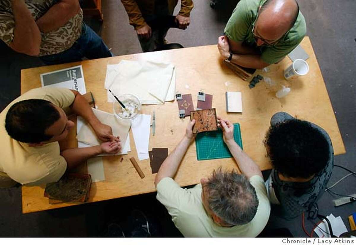 Dominic Riley, center, teaching student how to restore old books, Thursday June 14, 2007, at the San Francisco Center for the Book in San Francisco, CA. (Lacy Atkins /San Francisco Chronicle) ***Dominic Riley MANDATORY CREDITFOR PHOTGRAPHER AND SAN FRANCISCO CHRONICLE/NO SALES-MAGS OUT