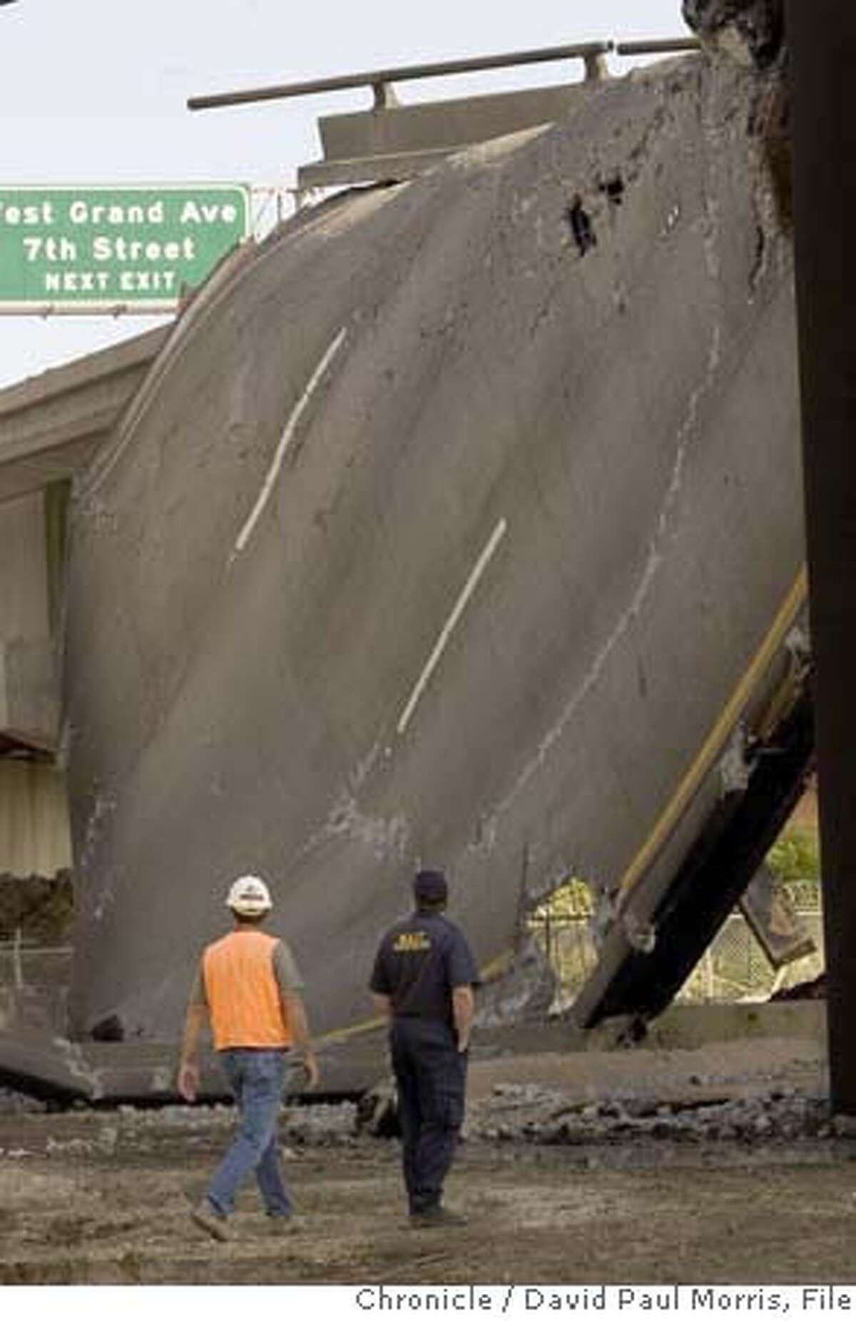 Emeryville CA - APRIL 29: Caltrans workers along with federal investigators look over the damage to the 580 hwy on April 29, 2007 in Emeryville, California. A tanker truck crashed and burned causing the elevated roadway that carried eastbound traffic from the Bay Bridge onto Interstates 580 and 980 and state Highway 24 to melt and crumble to the ground.(Photo by David Paul Morris/The Chronicle)