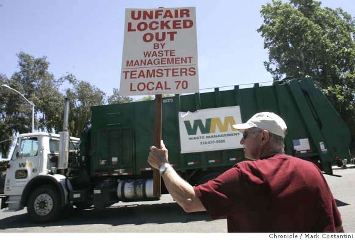 Locked out Teamster Sam Drago, who has been working for the company for 37 years, pickets passing grabage truck. Please shoot overall of the dump PHOTO: Mark Costantini / The Chronicle MANDATORY CREDIT FOR PHOTOGRAPHER AND SAN FRANCISCO CHRONICLE/NO SALES-MAGS OUT