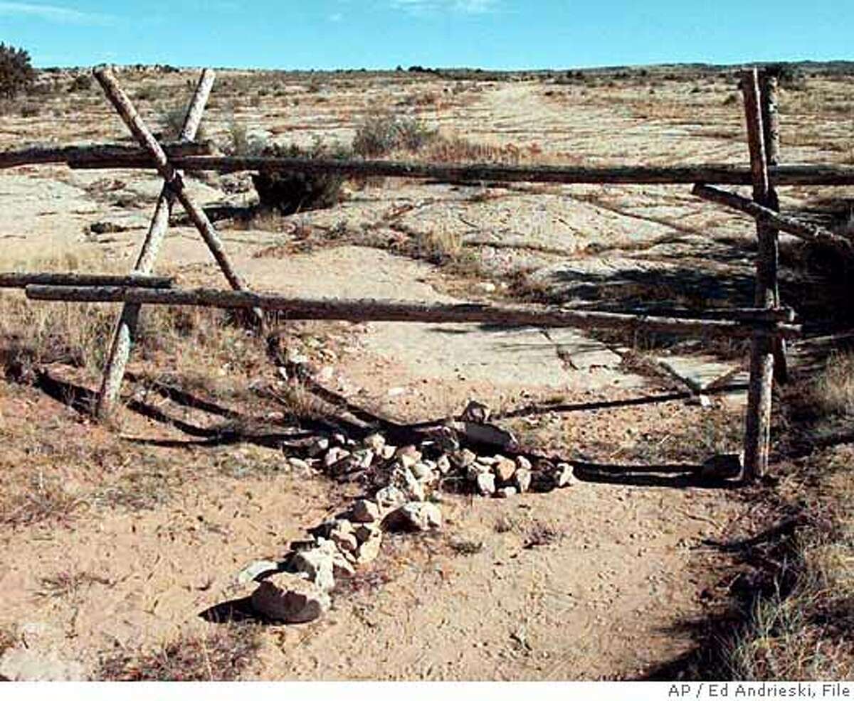 ADVANCE FOR WEEKEND EDITIONS OCT. 23-24--FILE--A cross made of stones rests below the fence in Laramie, Wyo., in this file photo taken Saturday, Oct. 9, 1999, where over a year ago gay Wyoming student Matthew Shepard was tied and pistol whipped into a coma. He later died. The opening statements in the trial for the remaining suspect, Aaron McKinney, is scheduled to begin Monday. (AP Photo/Ed Andrieski, File) Ran on: 07-12-2007 The fence on which Matthew Shepard hung for 18 hours before he was found became a monument until the property owner took it down.