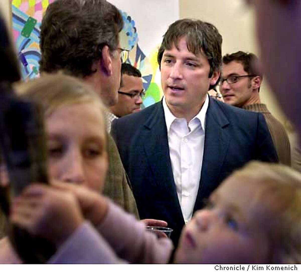 10/3/03 in San Francisco. Gonzalez, center, facing camera, talks with colleagues and attendees. Profile of S.F. Mayoral candidate Matt Gonzalez. We drop in on a reception for artist Rebecca Miller at Gonzalez's Supes President office.Her paintings will hang in Gonzalez's office during the month of October. KIM KOMENICH / The Chronicle