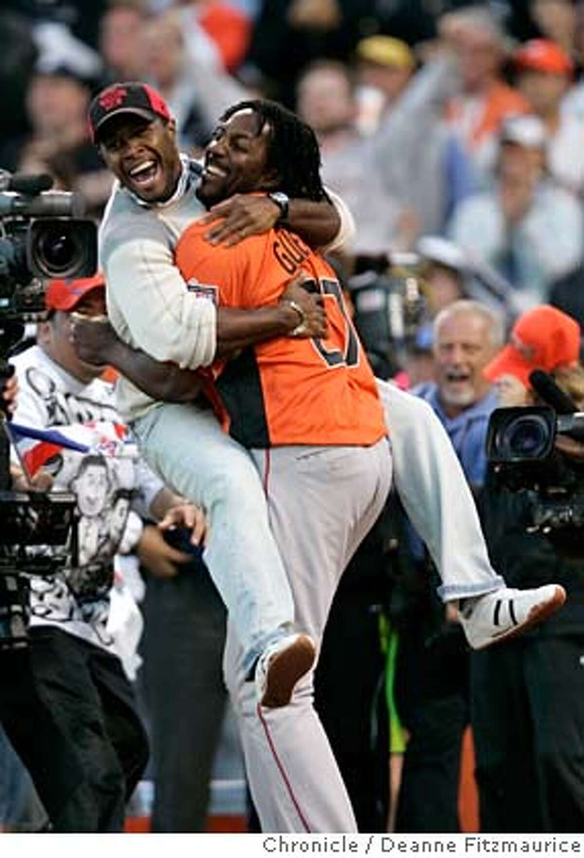 Vladimir Guerrero's cousin Wilfredo Paulino congratulates Guerrero after he won the Home Run Derby. Home Run Derby at AT&T Park in San Francisco, CA, on Monday, July, 9 2007. photo taken: 07/09/2007 Deanne Fitzmaurice / The Chronicle ** (cq) MANDATORY CREDIT FOR PHOTOG AND SF CHRONICLE/NO SALES-MAGS OUT