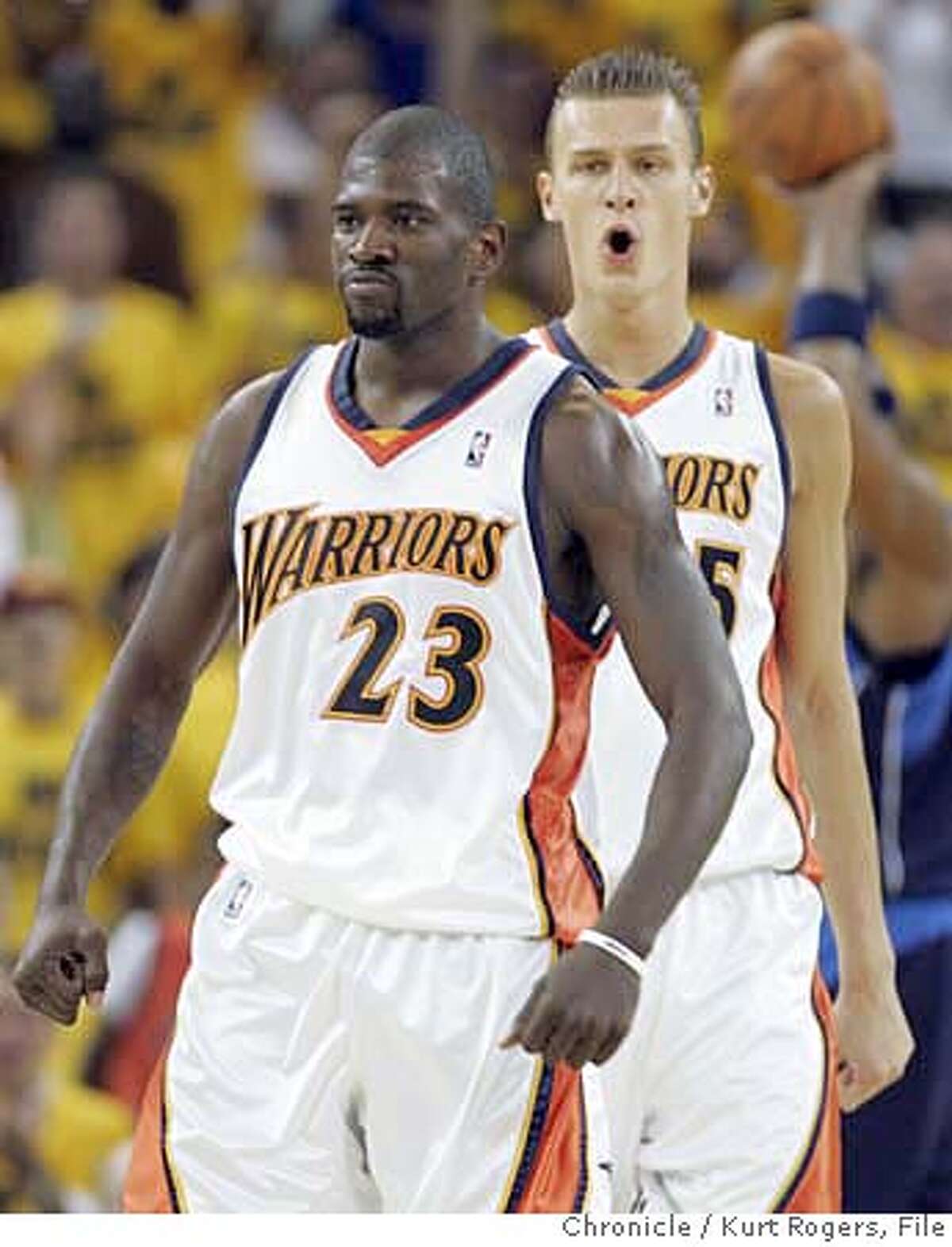 Jason Richardson is pumped after his score as Andris Biedrins looks on Dallas Mavericks vs. Golden State Warriors in Playoff Game #3 at the ORCLE arena WEDNESDAY, APRIL 25, 2007 KURT ROGERS OAKLAND THE CHRONICLE KURT ROGERS/THE CHRONICLE WARRIORS_0652_kr.jpg Ran on: 04-28-2007 Andris Biedrins, a surprise starter, and Monta Ellis double team Dallas Devin Harris, whose elbow catches Ellis nose during Game 3 in Oakland. ALSO RAN 05-16-2007 MANDATORY CREDIT FOR PHOTOG AND SF CHRONICLE / NO SALES-MAGS OUT