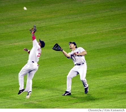 Baseball In Pics - Johnny Damon and Damian Jackson collide attempting to  catch a ball in the outfield, 2003