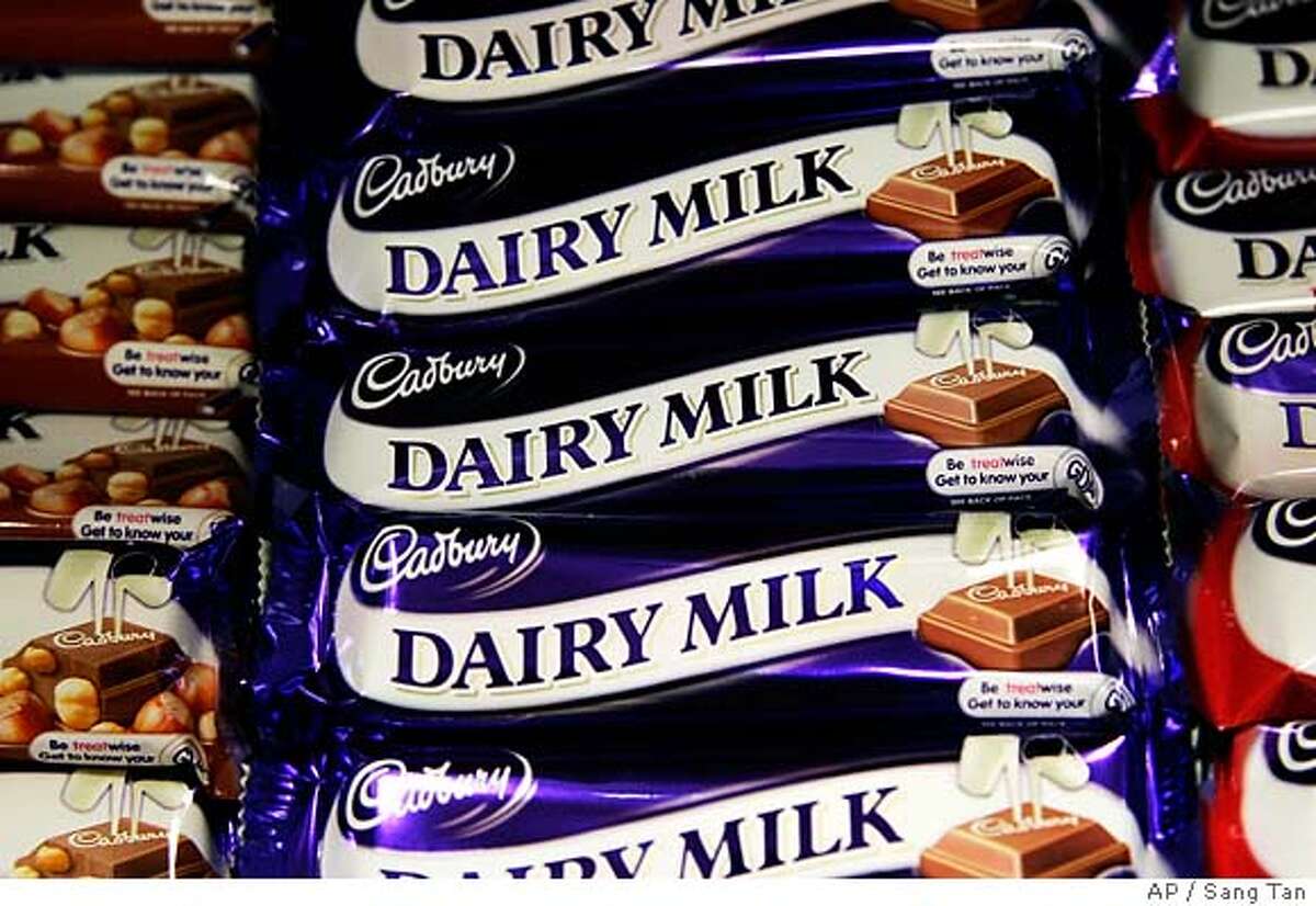 Bars of Cadbury milk chocalate are seen on a shelf of a store in London, Tuesday, June 19, 2007. Confectionery and drinks giant Cadbury Schweppes today announced plans to cut its global workforce by around 15 per cent, equivalent to around 7,5000 jobs. The company employs an estimated 50,000 people in confectionery worldwide, including about 6,000 staff in the UK. (AP Photo/Sang Tan)