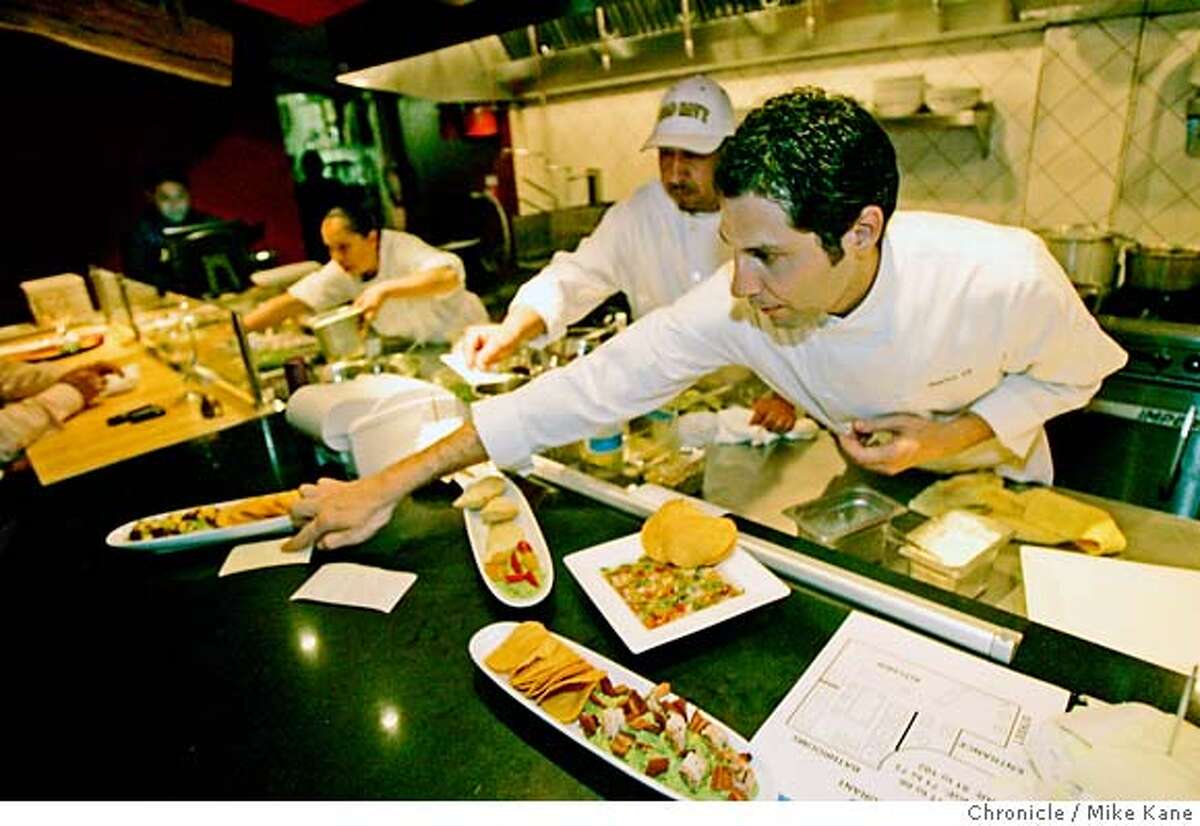 WHATS27_DF_140.JPG Head Chef David Rosales checks an order at Mexico DF, a new high-profile upscale Mexican restaurant serving large and small plates inspired by the Mexican capital, in San Francisco, CA, on Thursday, June, 21, 2007. photo taken: 6/21/07 Mike Kane / The Chronicle * David Rosales MANDATORY CREDIT FOR PHOTOG AND SF CHRONICLE/NO SALES-MAGS OUT