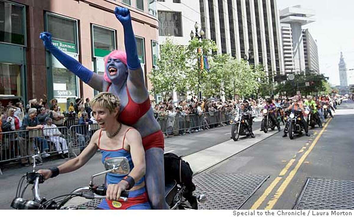 GAYPRIDE25_0108_LKM.jpg Jewlia Eisenberg lets out a scream while riding with An Marie Rodgers in the LGBT Pride Parade down Market St. in San Francisco, CA Sunday morning. When asked about their super hero costume choice, Rodgers said they thought it would be fun to go as "Super Gay." (Laura Morton/Special to the Chronicle) *** Jewlia Eisenberg *** An Marie Rodgers