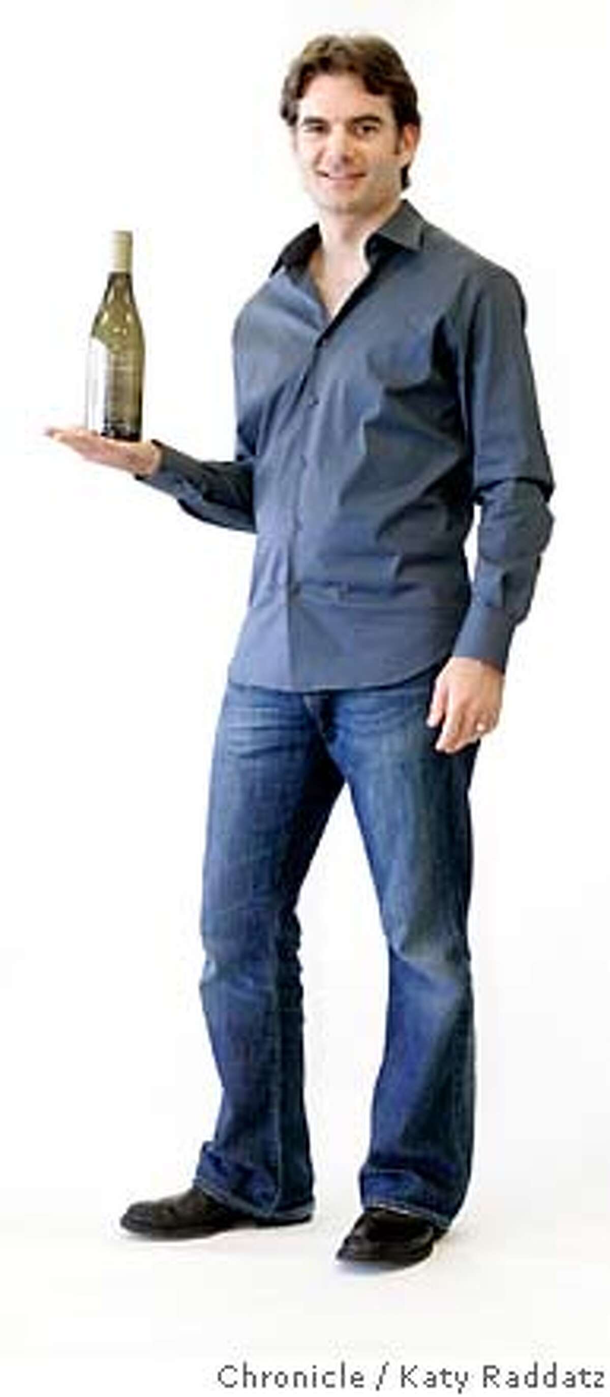 UNCORKED25_016_RAD.jpg SHOWN: Jeff Gordon, famous NASCAR race car driver, now makes his own wine. He's shown holding a bottle of 2005 Carneros Chardonnay. These pictures were made in Sonoma, CA. on Sunday, April 22, 2007. (Katy Raddatz/The Chronicle) **Jeff Gordon, Carneros Chardonnay Mandatory credit for the photographer and the San Francisco Chronicle. No sales; mags out.