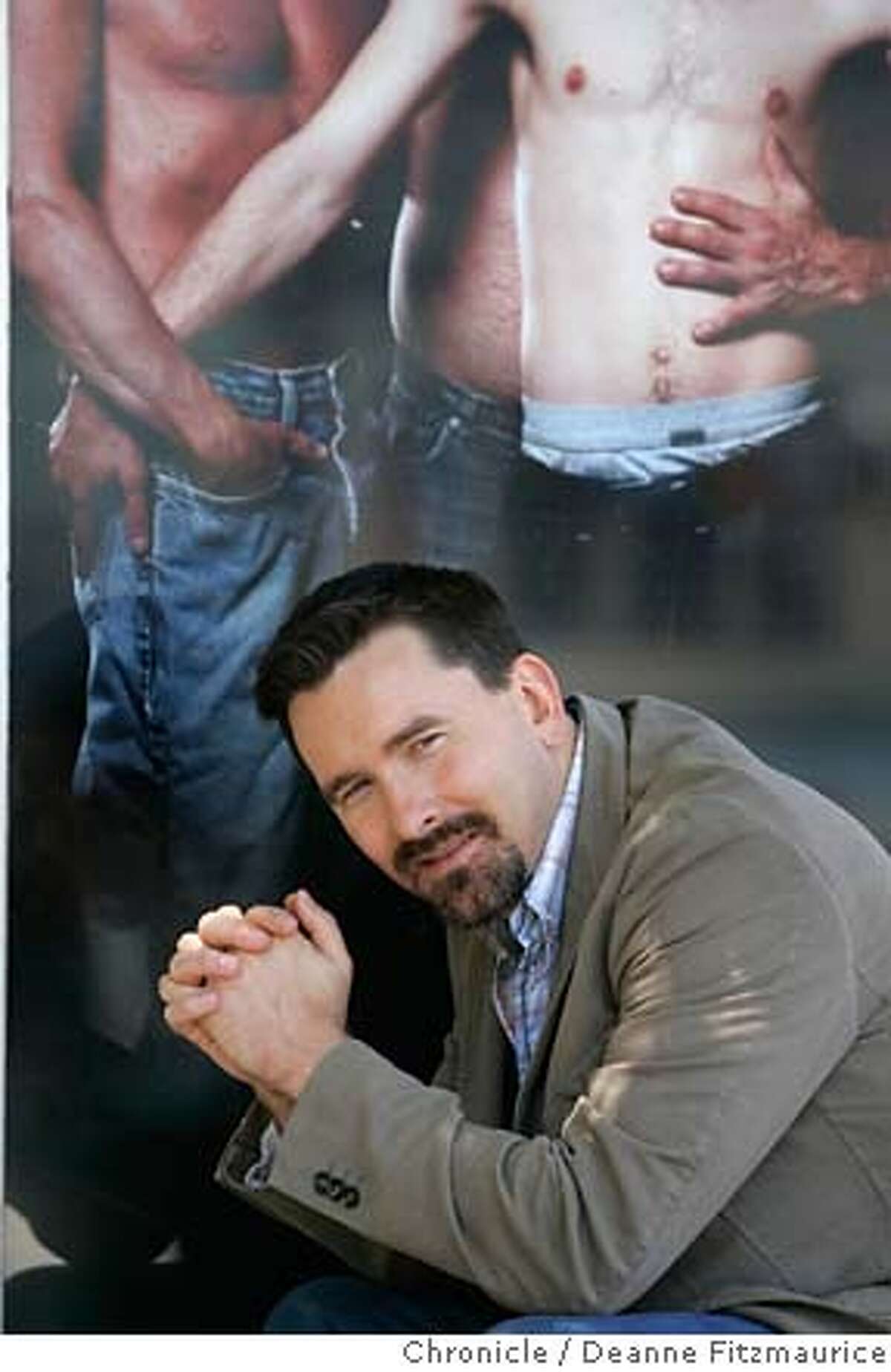 daddyhunt_0200_df.jpg Christopher Turner, 35, poses in front of a poster advertising his new website, daddyhunt.com which matches young gay men with older males. Deanne Fitzmaurice / The Chronicle Mandatory credit for photographer and San Francisco Chronicle. No Sales/Magazines out.