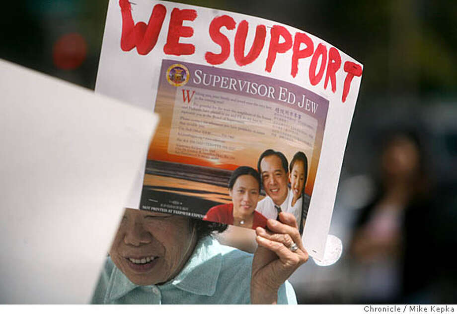 Koon Koon Luie holds a sign with other Ed Jew supporters, who feel the San Francisco supervisor is being wrongly treated for recently charges made against him, during a protest outside San Francisco City Hall Friday 6/15/07. Mike Kepka / The Chronicle Koon Koon Louie (cq) Photo: Mike Kepka