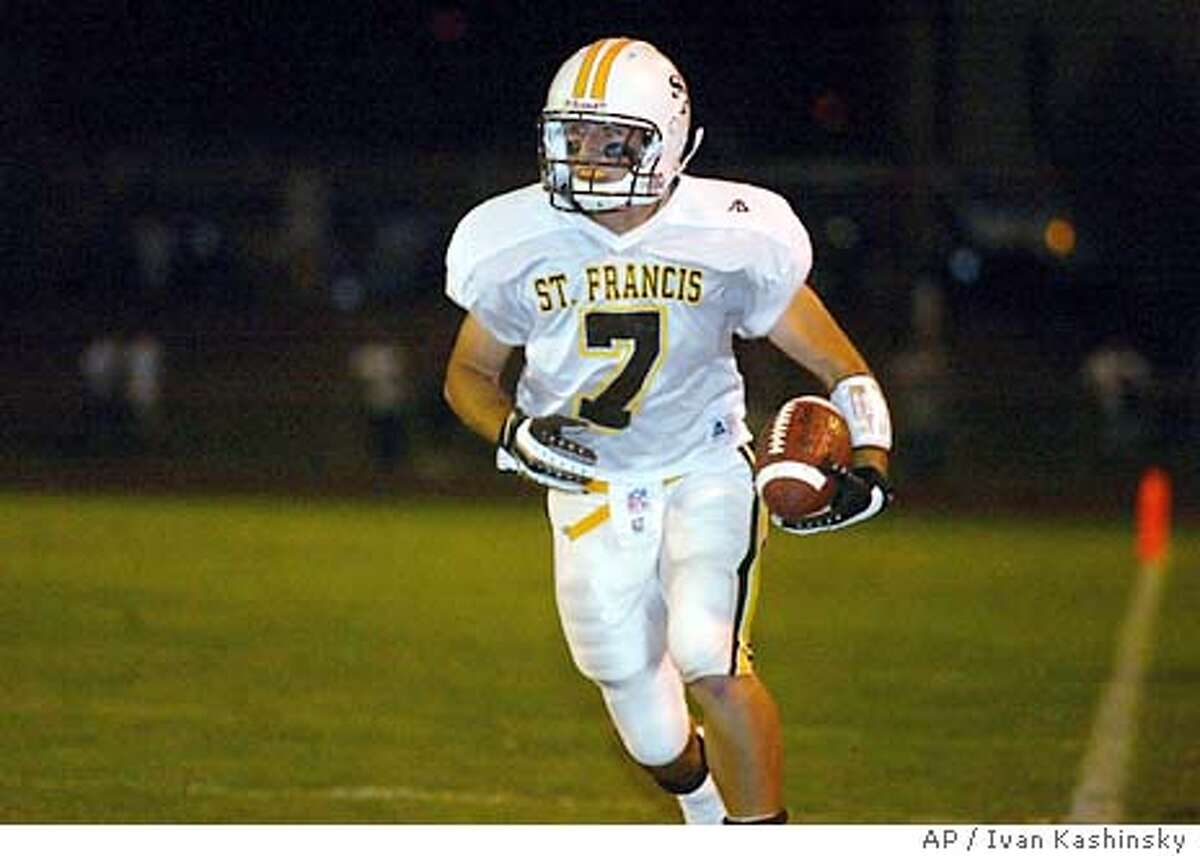 Daniel Descalso, 7, of the St. Francis Lancers, returns a punt in the first quarter at Los Gatos Highschool on Friday Semptember 19, 2003. He later scored the second touchdown of the game. (AP / Ivan Kashinsky) ; 1/28/02 in . Ivan Kashinsky / AP