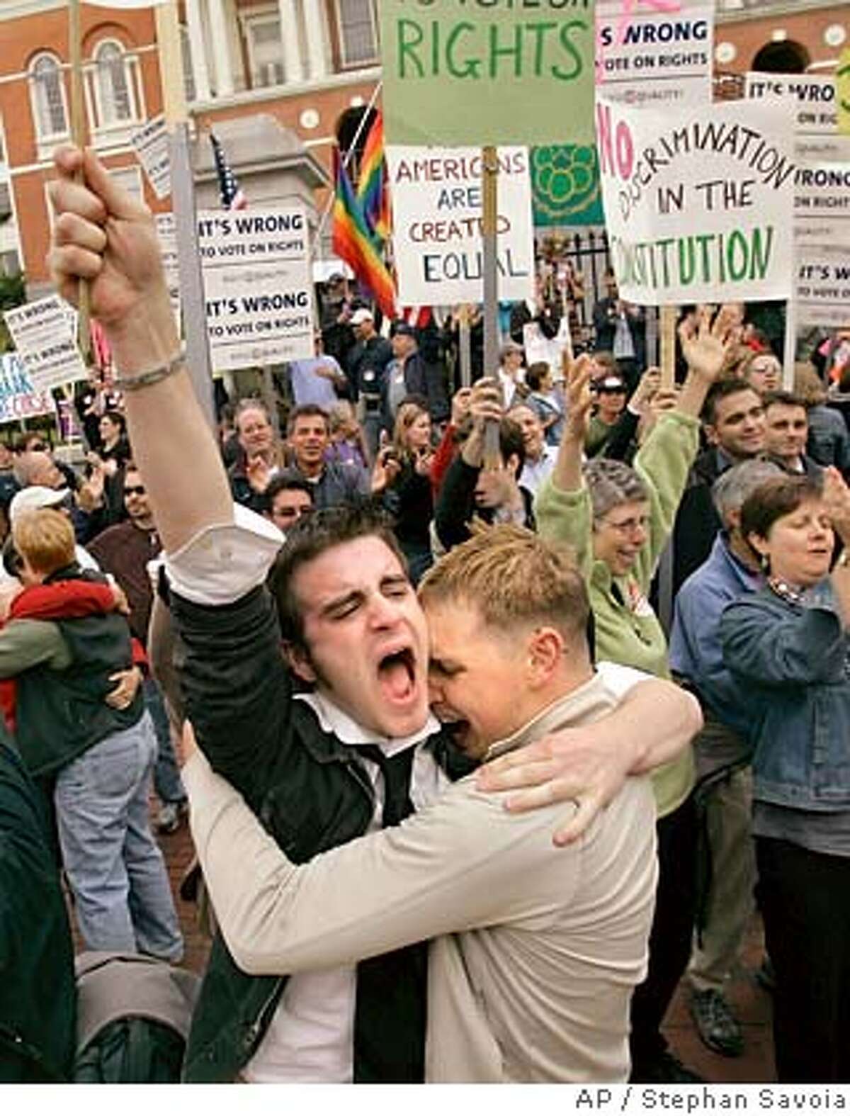 Greg Kimball, left, of Manchester, Mass., and his partner of five months, Brian O'Connor hug as they celebrate after Massachusetts lawmakers voted to kill a proposed constitutional amendment to ban gay marriage at the Statehouse in Boston, Thursday afternoon, June 14, 2007. Kimball said he and O'Connor plan to marry now that the legal issue is settled. (AP Photo/Stephan Savoia)