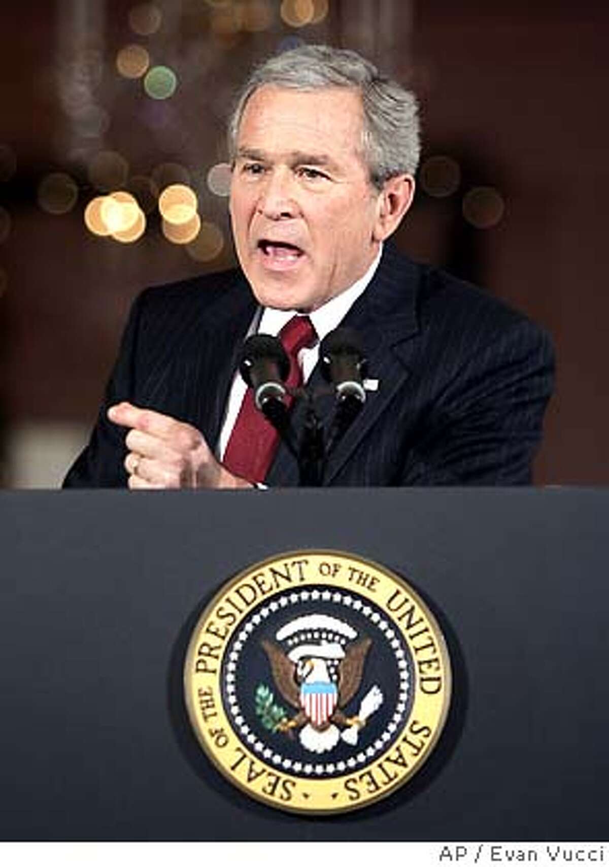 President Bush gestures during a news conference in the East Room of the White House on Monday, Dec. 19, 2005 in Washington. Bush, brushing aside bipartisan criticism in Congress, said Monday he approved spying on suspected terrorists without court orders because it was "a necessary part of my job to protect" Americans from attack. (AP Photo/Evan Vucci)