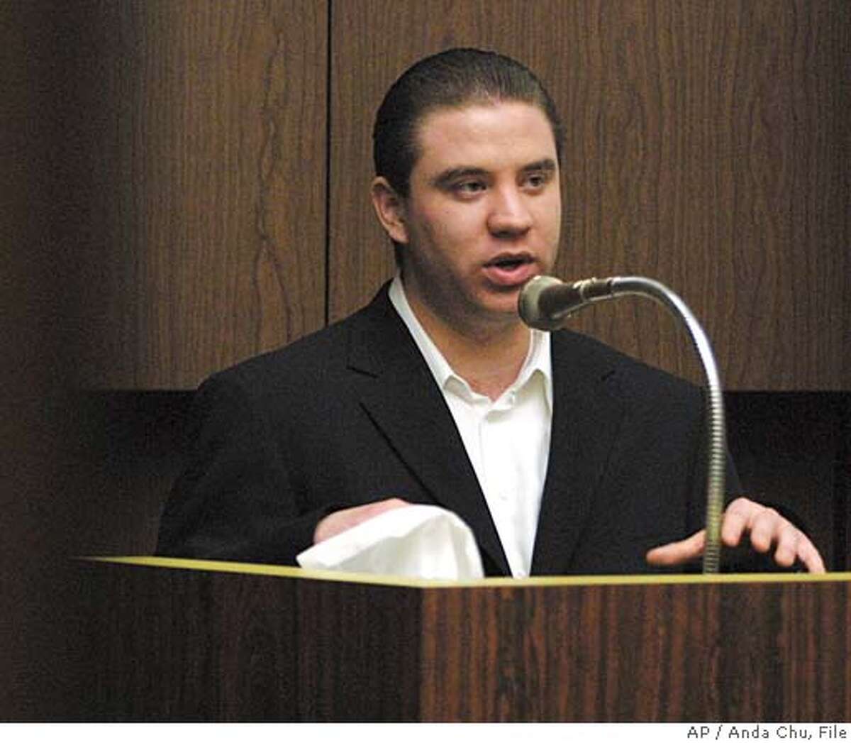Defendant Jason Cazares answers questions from his attorney during during the trial of Cazares, 24, Michael Magidson, 23, and Jose Merel, 24, in Alameda County Superior Court, Tuesday, May 18, 2004, in Hayward, Calif. The three men are charged with killing Eddie ``Gwen'' Araujo after discovering that the 17-year-old Araujo, who they knew as a girl called ``Lida,'' was biologically male. (AP Photo/Anda Chu, Pool) ALSO RAN: 06/28/2004 Jason Cazares Ran on: 06-28-2004 Gwen Araujo ALSO Ran on: 07-31-2004 Jason Cazares testified in May during his first trial, which ended with a hung jury. ALSO RAN 08-25-2005 Jason Cazares Ran on: 08-25-2005 Jason Cazares Ran on: 08-26-2005 Jason Cazares POOL PHOTO