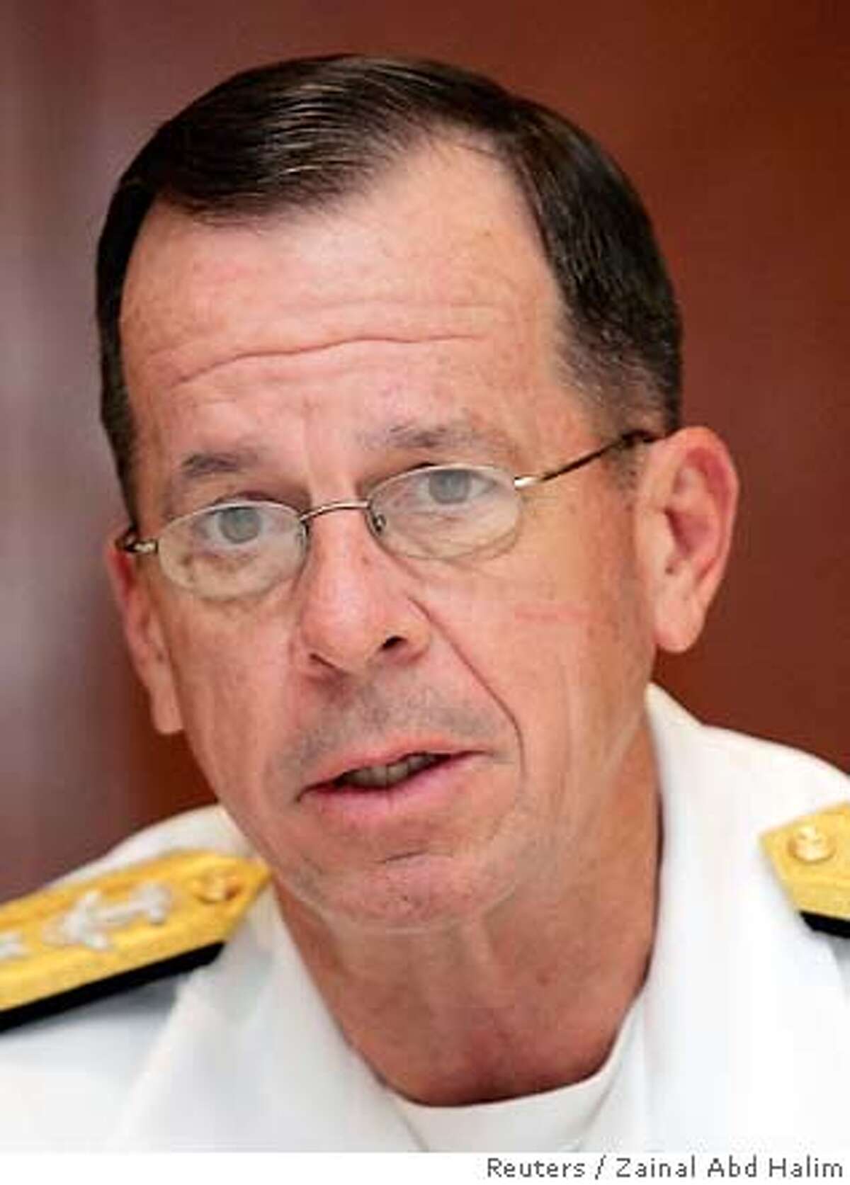 U.S Chief of Naval Operations Admiral Michael G. Mullen speaks during a news conference in Kuala Lumpur in this July 17, 2006 file photo. Mullen will replace General Peter Pace, the current Chairman of the Joint Chiefs of Staff, who will retire at the end of his terma later this year, Defense Secretary Robert Gates said on June 8, 2007. REUTERS/Zainal Abd Halim/Files (MALAYSIA) 0