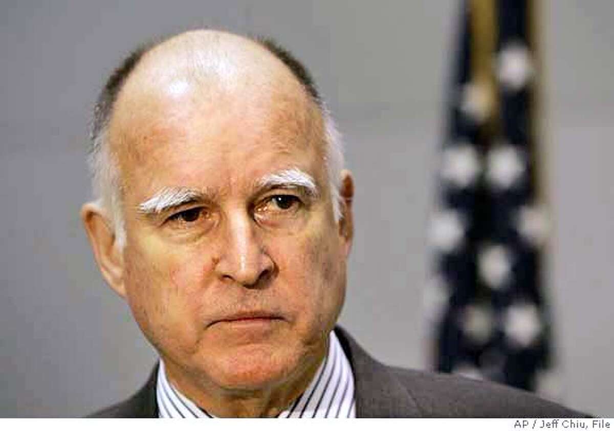 California Attorney General Jerry Brown speaks at a news conference in San Francisco, Thursday, Feb. 1, 2007. Brown said Thursday he will pursue a lawsuit against the six largest U.S. and Japanese automakers in which the state seeks millions of dollars in damages caused by vehicle emissions of greenhouse gases. (AP Photo/Jeff Chiu) Ran on: 02-02-2007 Attorney General Jerry Brown had expressed doubt about the states case during his campaign. Ran on: 02-02-2007 Attorney General Jerry Brown had expressed doubt about the states case during his campaign. Ran on: 02-02-2007 Ran on: 02-02-2007 ALSO Ran on: 02-23-2007 Attorney General Jerry Brown argues that Prop. 83s residency restrictions should apply to previously registered sex criminals. Ran on: 02-23-2007 Attorney General Jerry Brown argues that Prop. 83s residency restrictions should apply to previously registered sex criminals, which would require tens of thousands of offenders to vacate their homes. Ran on: 05-17-2007 High-wattage pitch: New billboard blasts a new ad every five seconds at motorists entering and leaving the East Bay.