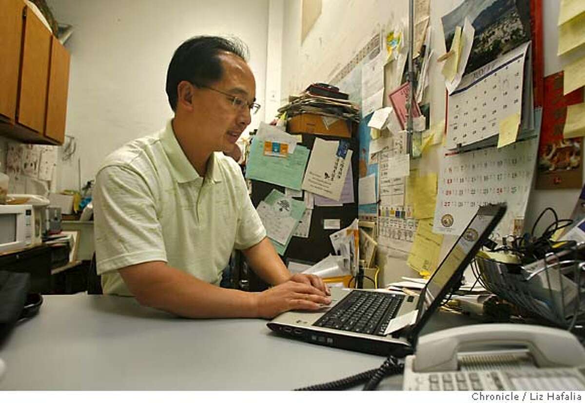 San Francisco Supervisor Ed Jew just returned from a ten day trip from China doing his first visit to his grandfather's province, Doumen. He is showing pictures on his computer at his chinatown plant shop of his family and trip. The plant shop is his family business that has been around since 1927. He is being investigated by the FBI for a cash payment he received from businessmen facing city permit problems -- has hired a former federal prosecutor to represent him. Photographed by Liz Hafalia/The Chronicle/San Francisco/6/5/07 **Ed Jew cq