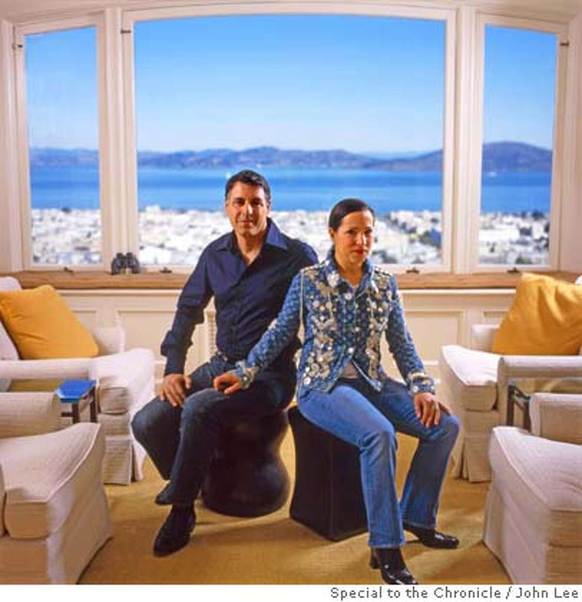 � 2500STEINER_KOUNALAKIS01JOHNLEE.JPG Markos Kounalakis (cq), left, and his wife Eleni Tsakopoulos-Kounalakis, sitting in the living room at 2500 Steiner in San Francisco's Pacific Heights. Behind them are windows looking north out onto the San Francisco Bay. For Sam Whiting story on 2500 Steiner. By JOHN LEE/SPECIAL TO THE CHRONICLE