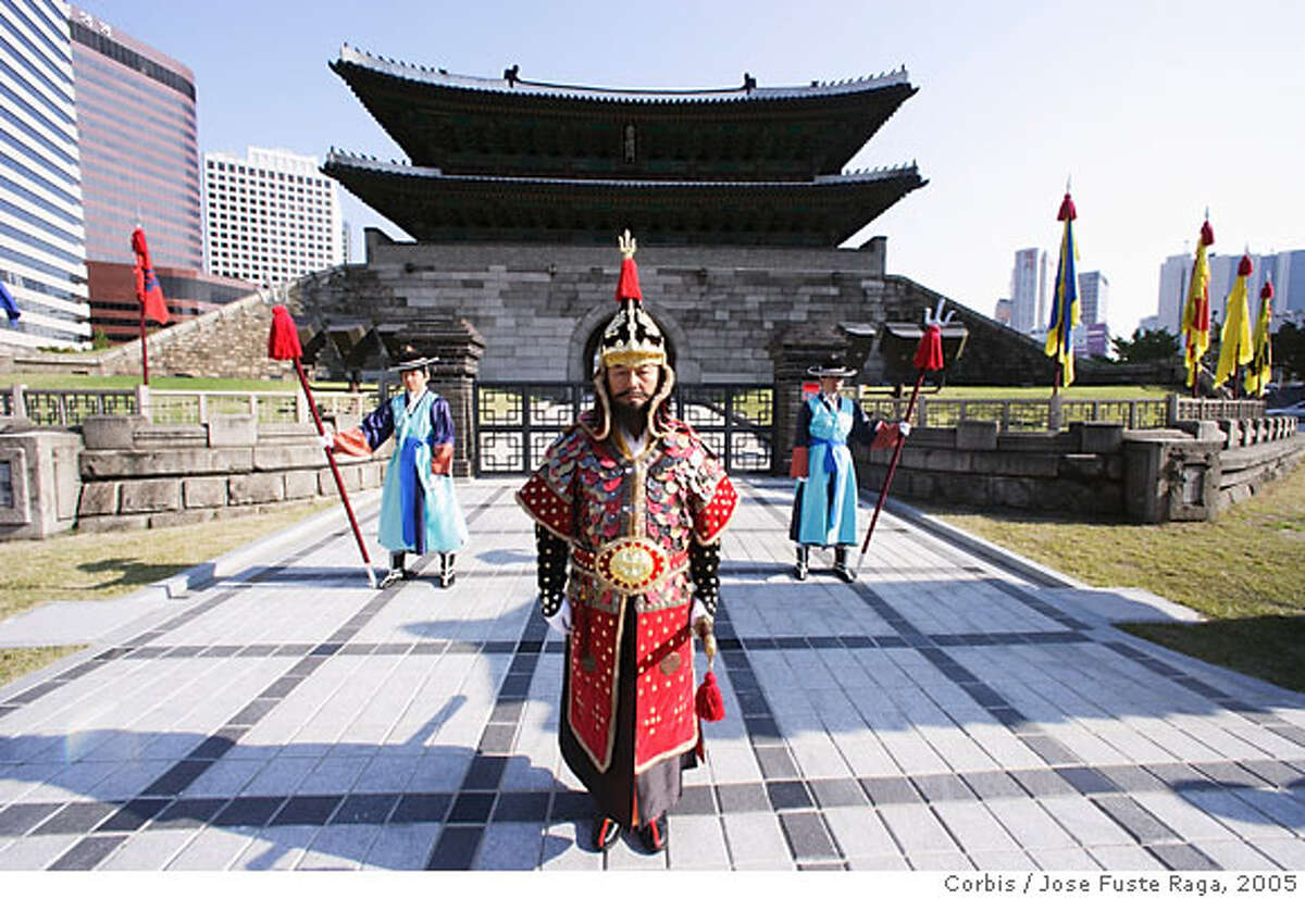 September 2005, Seoul, Korea --- Guards in Traditional Dress in Front of Namdaemun Gate --- Image by � Jose Fuste Raga/Corbis can use on internet