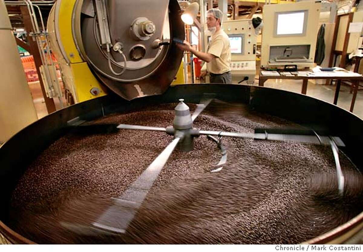 Roaster Eliseo Munoz tends to a freshly roasted batch. New Peet's roasting plant in Alameda. Story will be on the magic of Peets roasting secrets and the coup for Alameda, which stole the venerable coffee maker from Emeryville and recently lured Clif Bar from Berkeley. PHOTO: Mark Costantini / The Chronicle MANDATORY CREDIT FOR PHOTOGRAPHER AND SAN FRANCISCO CHRONICLE/NO SALES-MAGS OUT