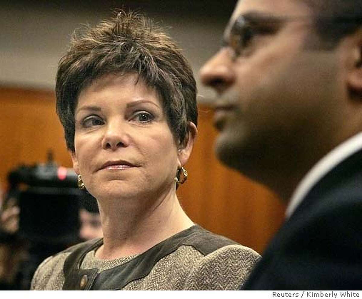 Former Hewlett-Packard Co. Chairman Patricia Dunn (L) looks at her attorney Raj Chatterjee inside a courtroom during her arraignment in San Jose, California, November 15, 2006. Dunn pleaded not guilty to felony charges for spying on reporters and directors in a scandal that sullied the reputation one of Silicon Valley's most venerable and respected companies. REUTERS/Kimberly White (UNITED STATES) Ran on: 11-16-2006 Patricia Dunn looks at her attorney, Raj Chatterjee, during her arraignment. Ran on: 03-15-2007 Stanford Associate Professor Vijay Pande
