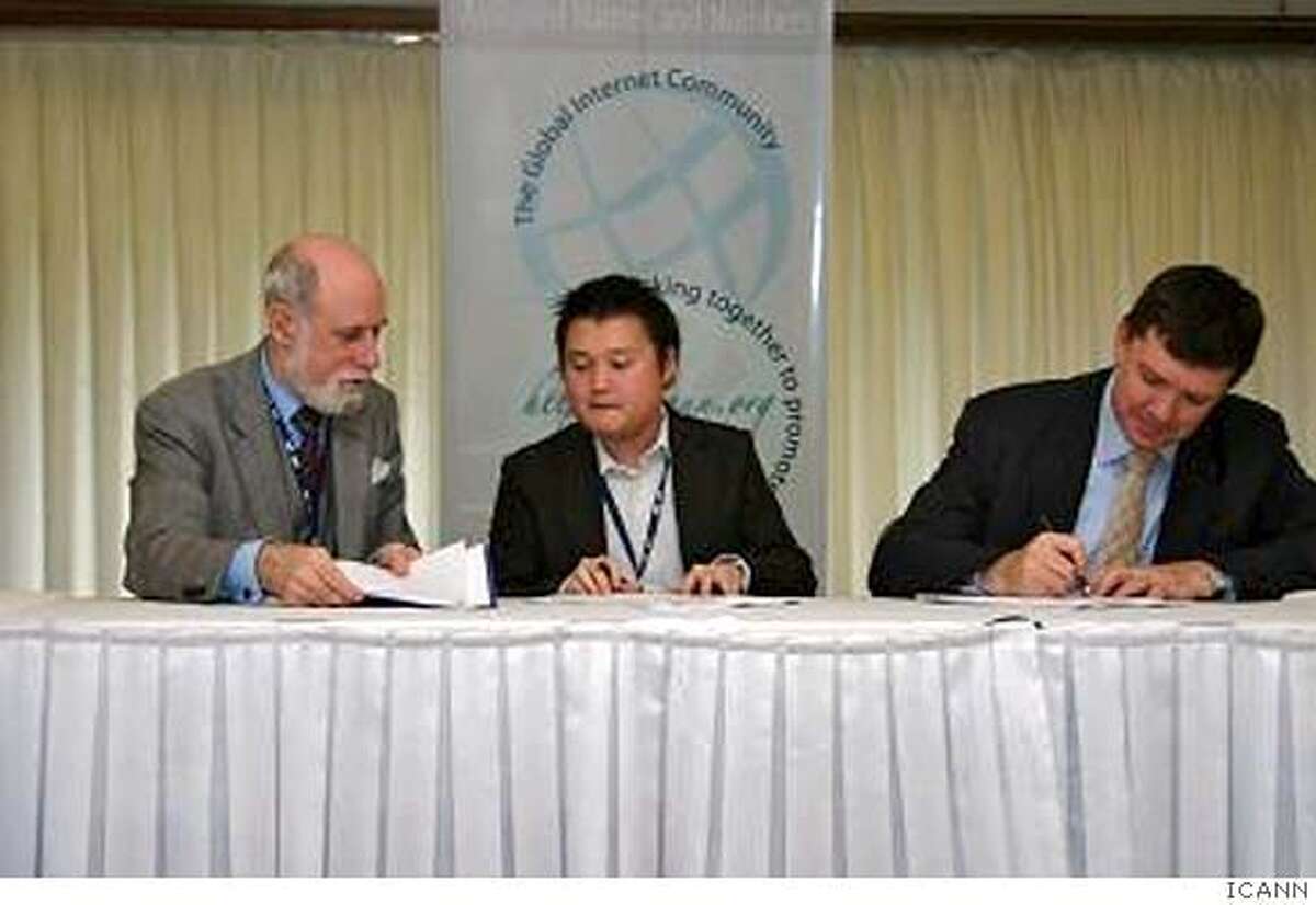Dot Commencement: ICANN Chair Vint Cerf and CEO Paul Twomey sign the agreement creating the .asia top-level domain. Photo Courtesy ICANN