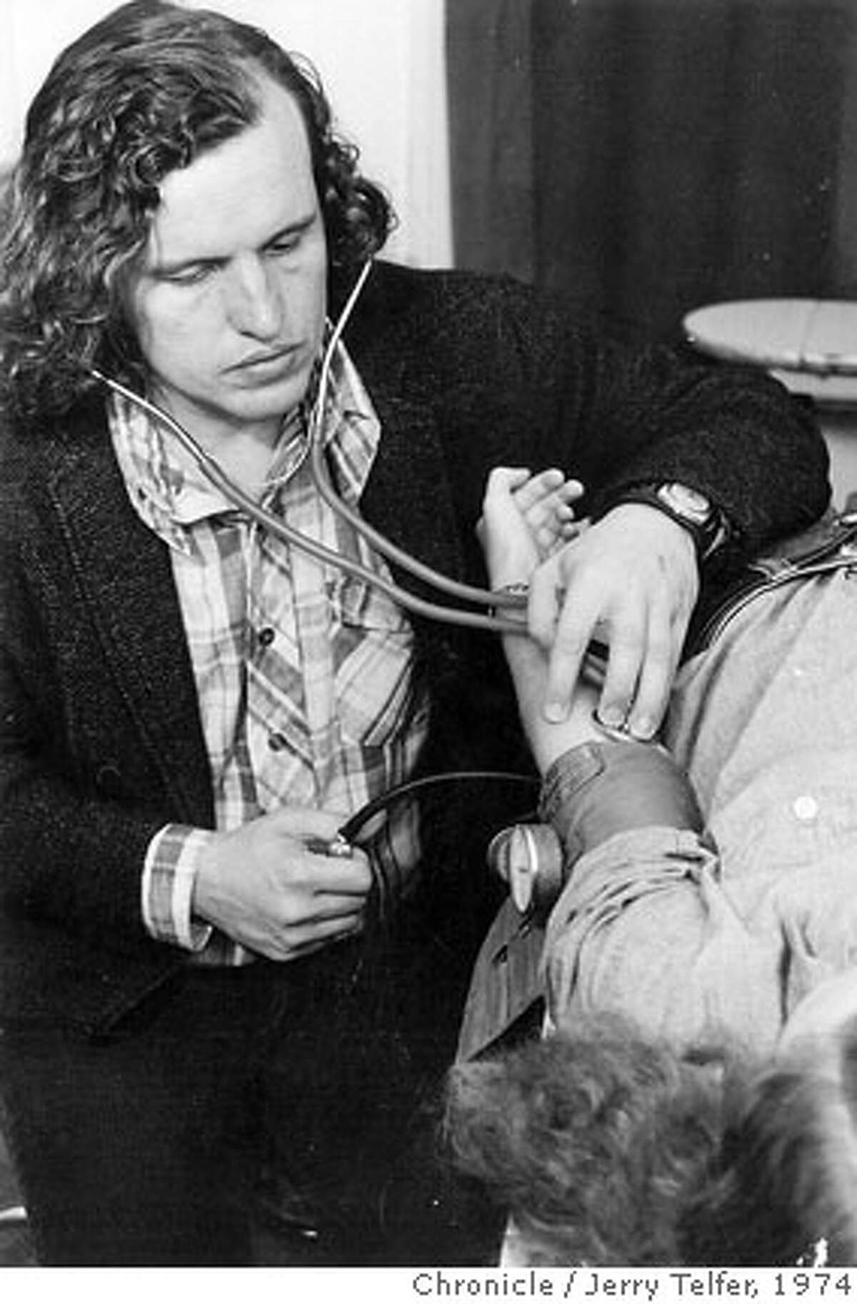 November 1, 1974 - Dr. David E. Smith takes a patient's blood pressure at the Haight-Ashbury Free Medical Clinic. Jerry Telfer/ Chronicle File Photo 1974