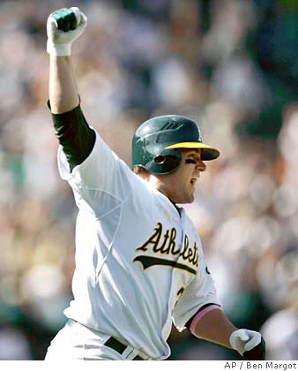 Oakland Athletics' Jack Cust celebrates after hitting a three-run walk-off home run off Cleveland Indians' Fernando Cabrera to win the baseball game 10-7 Sunday, May 13, 2007, in Oakland, Calif. (AP Photo/Ben Margot)
