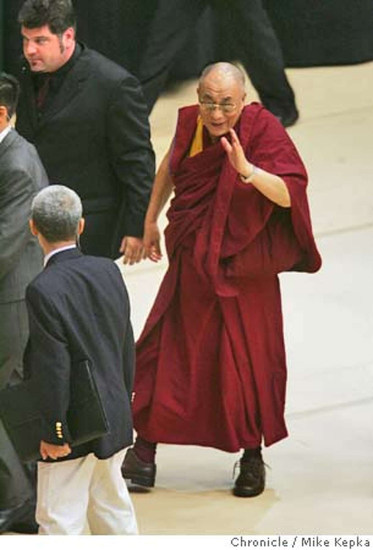 dalaiLama274_mk.JPG The Dalai Lama waves goodbye after his Friday lecture at Stanford. The Dalai Lama visited the Stanford Campus Friday where he led a two hour discussion at the Maples Pavilion on the topic of meditation and spiritual balance and awarness. date} Mike Kepka / The Chronicle MANDATORY CREDIT FOR PHOTOG AND SF CHRONICLE/ -MAGS OUT