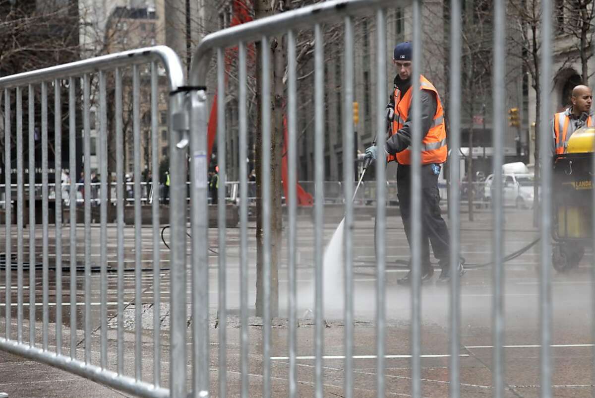 A closed Zuccotti Park is cleaned in New York, Sunday, March 18, 2012. Dozens of police officers cleared the park late Saturday and early Sunday where the Occupy movement was born six months ago and made several arrests after hundreds of protesters returned in an anniversary observance and defiantly resisted calls to clear out. (AP Photo/Seth Wenig)