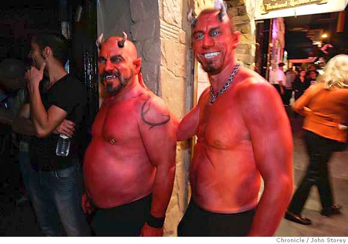 Left to Right: Allen Turpin and Justin Roningen as Devils. Halloween in the Castro District. John Storey San Francisco Event on 10/31/05