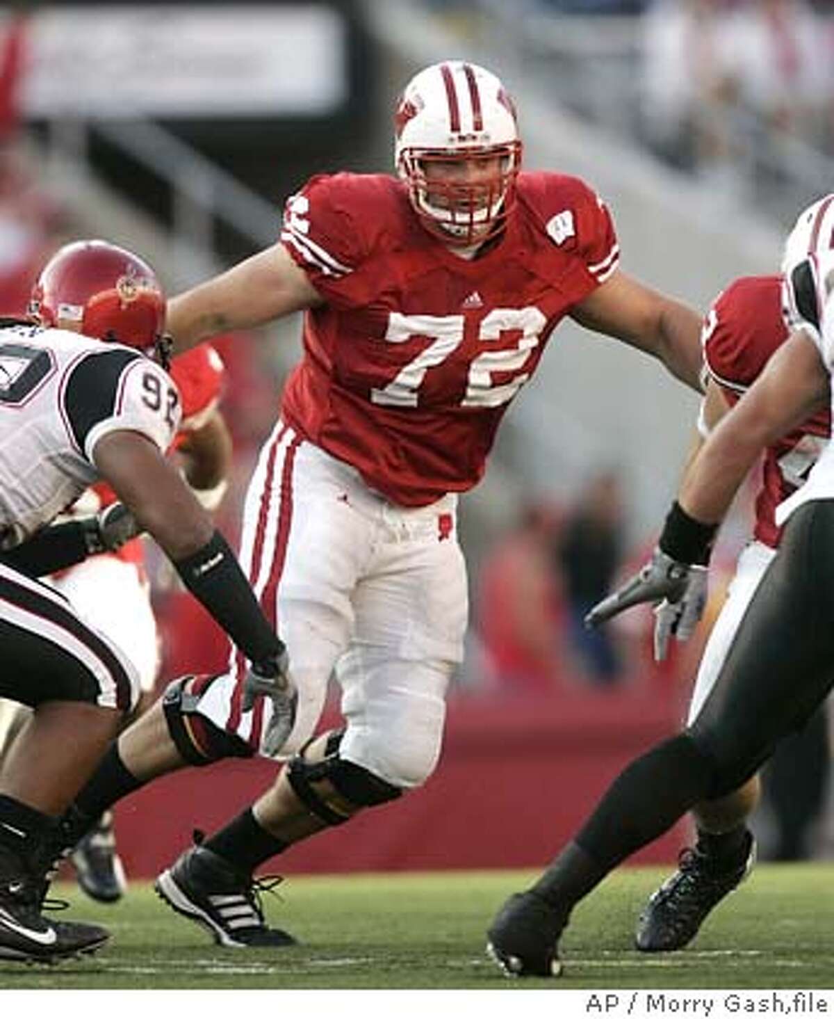 ** FILE ** Wisconsin offensive lineman Joe Thomas (72) looks to block during the second half of a football game against San Diego State Saturday, Sept. 16, 2006, in Madison, Wisc. (AP Photo/ Morry Gash,file) FOR USE AS DESIRED WITH NFL DRAFT STORIES. SEPT. 16, 2006 FILE PHOTO. EFE OUT