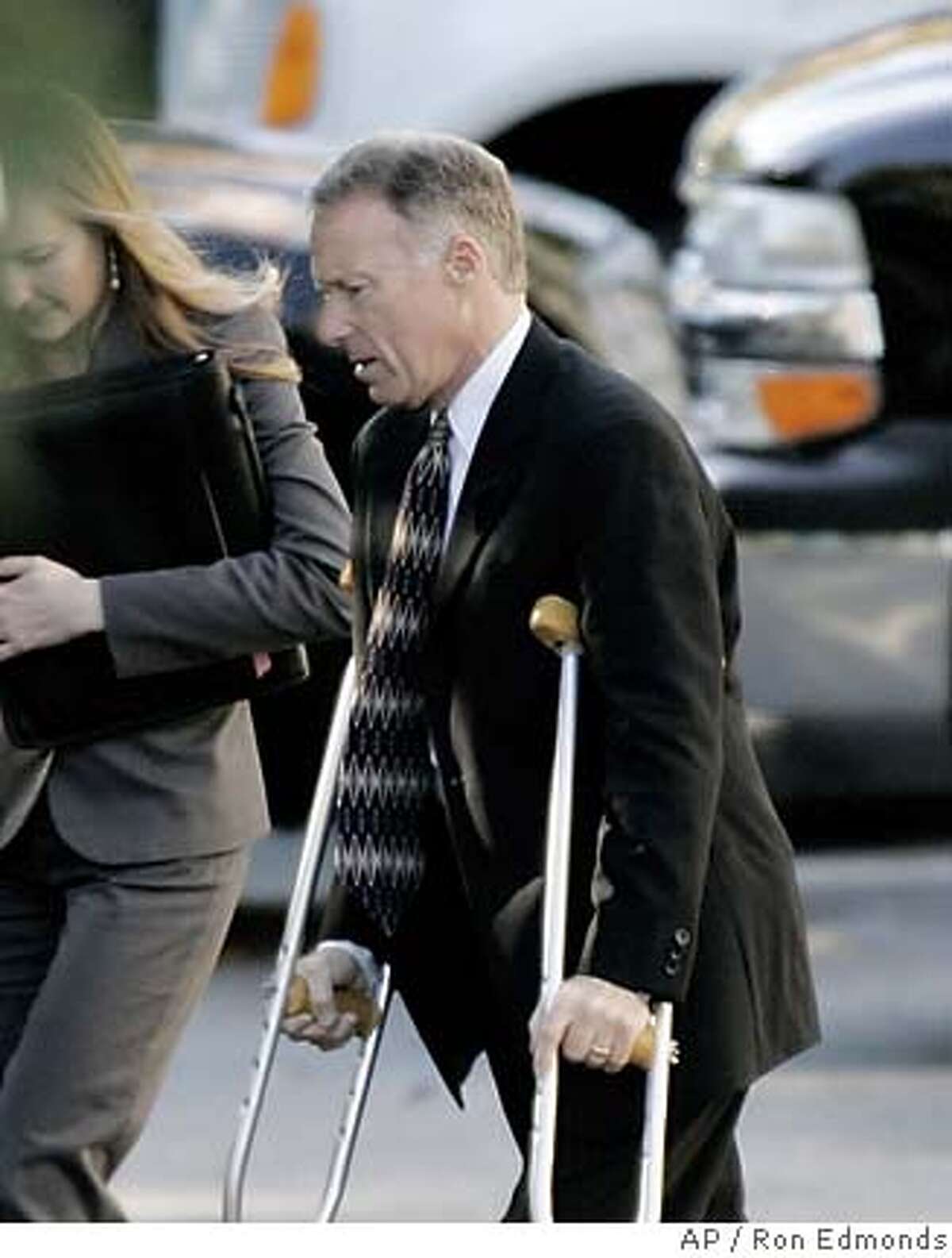 Vice President Dick Cheney's chief of staff, I. Lewis "Scooter" Libby, walks into the White House, Wednesday, Oct. 26, 2005, using crutches. Lawyers representing key White House officials expect Special Counsel Patrick Fitzgerald to decide this week whether to charge Libby and top presidential political adviser Karl Rove in the leak of a CIA officer's identity. (AP Photo/Ron Edmonds)
