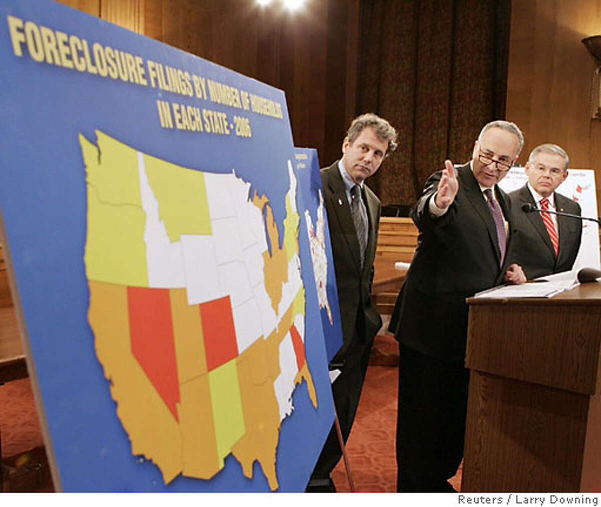 U.S. Senators' Charles Schumer (D-NY-C), Sherrod Brown (D-Oh-L), and Bob Menendez (D-NJ), present a Congressional Joint Economic Committee report revealing the impact of subprime mortgages and their fallout across America, while on Capitol Hill in Washington, April 11, 2007. REUTERS/Larry Downing (UNITED STATES) Ran on: 04-22-2007 Sens. Charles Schumer, D-N.Y., Sherrod Brown, D-Ohio, and Bob Menendez, D-N.J., present a report on subprime mortgages this month.