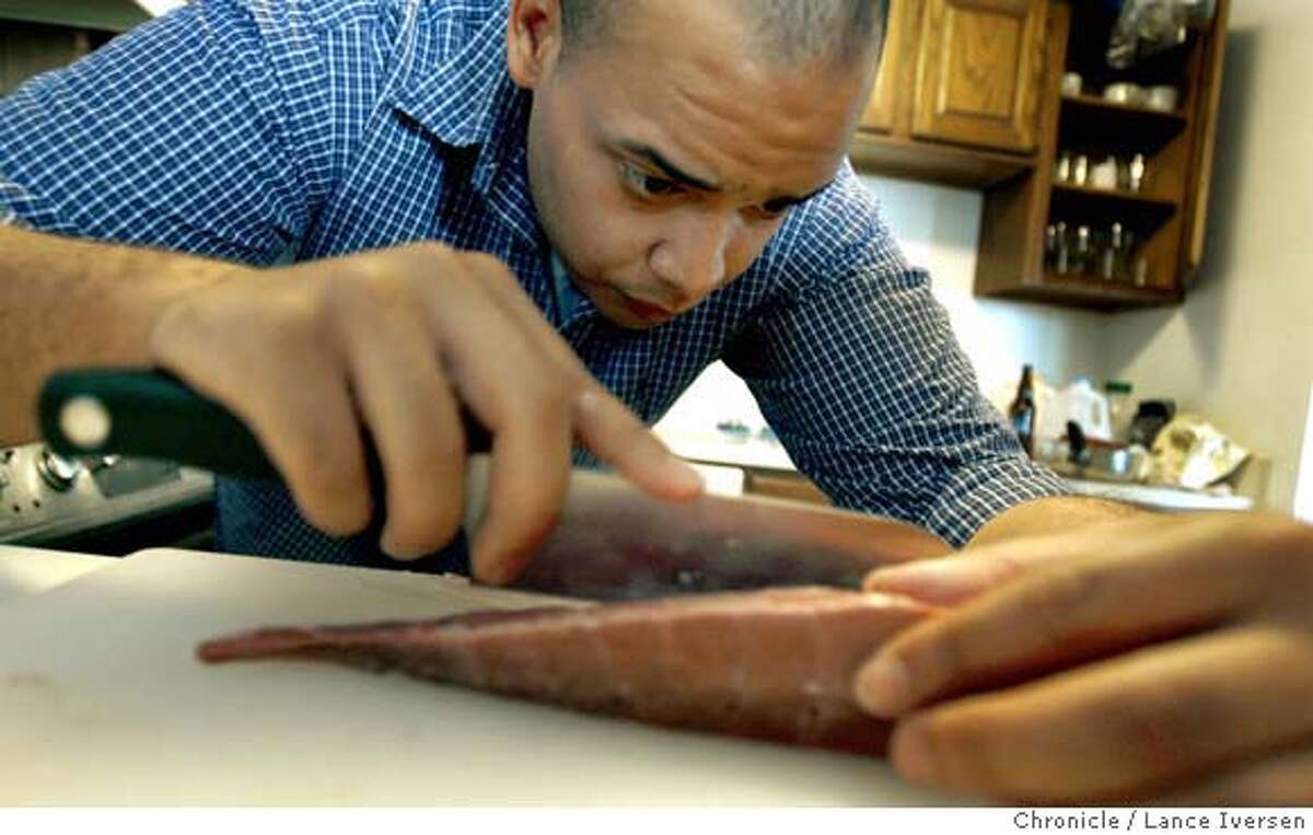 FOOD2.0_10683.JPG Michael Seibel cuts into a large piece of tuna in preparations for a Sushi dinner that will feed 20 or more. Michael Seibel, the chief operating officer of Justin.tv, is also the startup's cook, radically improving the junk food diets of entrepreneurs in his apartment building. Justin.tv is a San Francisco startup that has created an online television reality show starring one of its founders, Justin Kan. Kan wears a camera that's on 24/7; folks follow along on the Web. (There are several) and an ever-widening group of hungry startup pals. Seibel caters to vegetarians and prides himself on never making the same dish twice. Every Thursday, Seibel makes dinner for an average of 20 people (and 10 laptops), getting even the most reticent young entrepreneur to eat a balanced meal including leafy greens. For some of the entrepreneurs, these are the only vegetables they eat all week long. This week, Justin.tv is having the dinner on Friday night to celebrate its "open beta" launch and Seibel is rolling sushi and mixing cocktails. March 9. 2007. San Francisco By Lance Iversen The Chronicle MANDATORY CREDIT PHOTOG AND SAN FRANCISCO CHRONICLE/NO SALES MAGS OUT