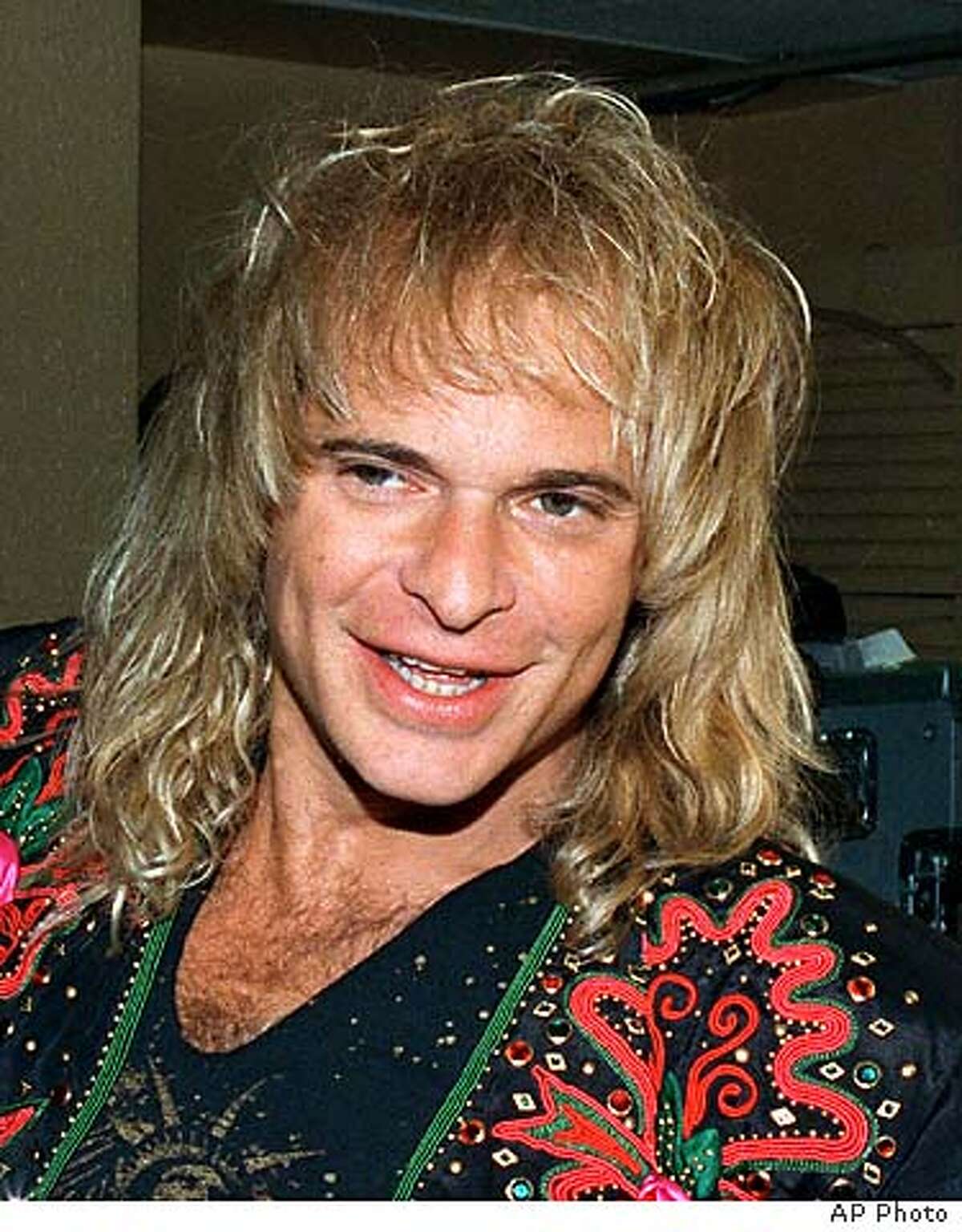 ROTH1-C-08MAY02-HM-AP --- Former Van Halen singer David Lee Roth is shown in this 1988 photo. Roth may seek punitive damages in a $5 million lawsuit alleging his insurance companies failed to fully reimburse him for damage to his Pasadena, Calif., home from a 1994 earthquake. On Thursday, Nov. 7, 1996, a judge ruled against a motion filed by RLI Insurance Co., one of three companies named in the suit, to eliminate the possibility of punitive damages being awarded, but left open the possibility he might later reversehimself. (AP Photo/) (BY /ASSOCIATED PRESS)