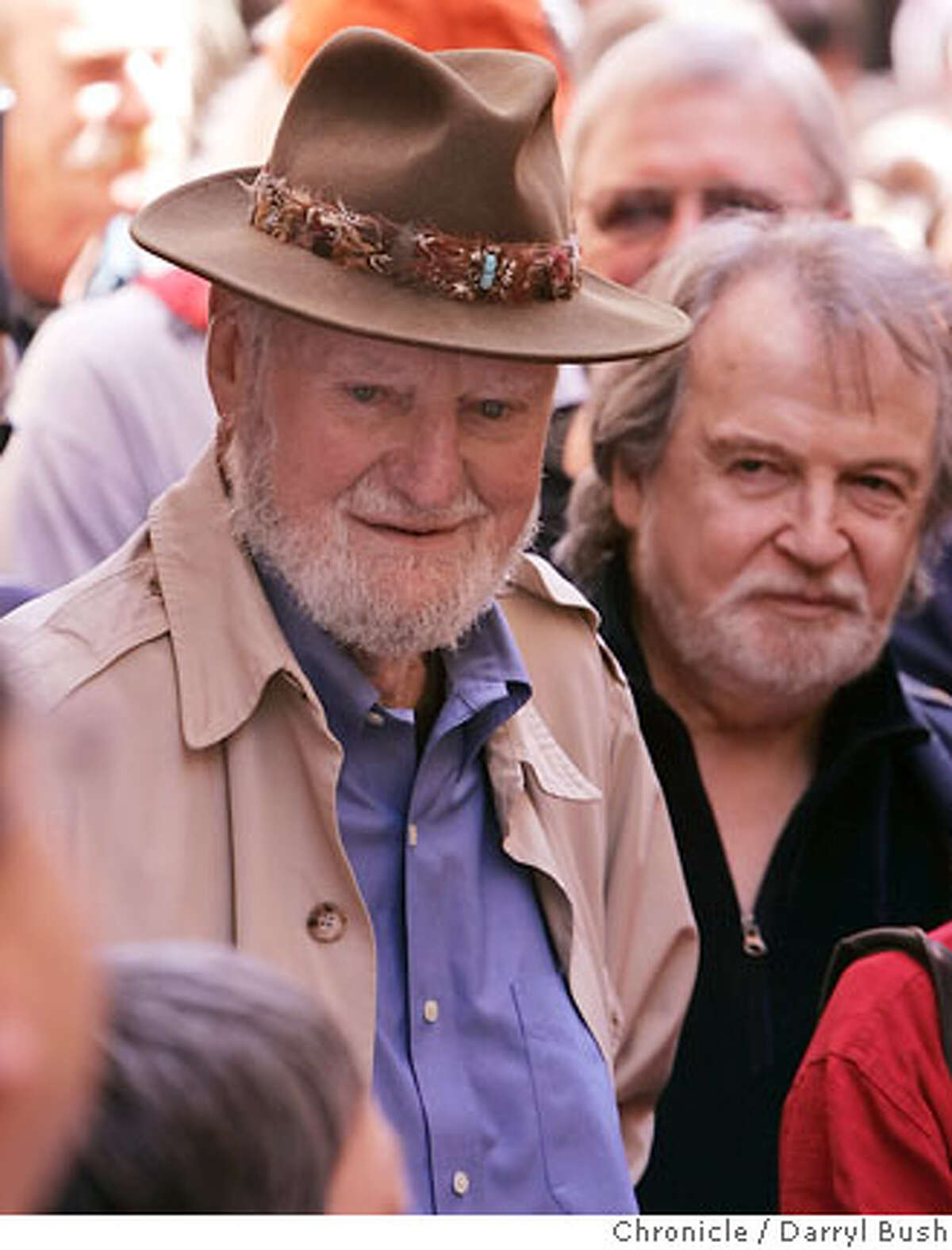 Poet Lawrence Ferlinghetti, owner of City Lights Bookstore, with friend, conductor George Cleve of Berkeley, back right, talks to many fans of his poetry as he attends with a crowd of hundreds at the Jack Kerouac Alley Dedication for the newly restored Jack Kerouac Alley between Grant and Coumbus in North Beach, which was attended by community leaders and local residents from North Beach and Chinatown and included entertainment and festivities from 12:00 to 4:00 p.m. in San Francisco, CA, on Saturday, March, 31, 2007. photo taken: 3/31/07 Darryl Bush / The Chronicle ** Lawrence Ferlinghetti (cq)