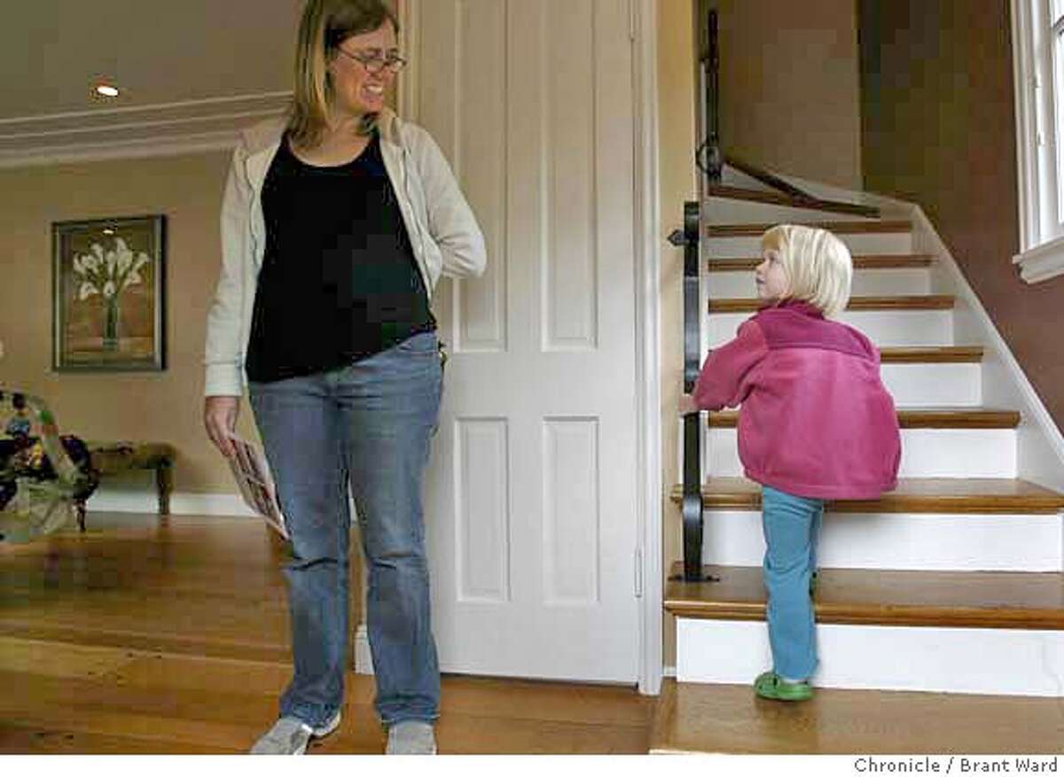 api_homes106.JPG Kristen Stoller, left, is being urged by her two year old daughter Abigail to check out the upstairs in a 3 bedroom home at 5861 Margarido Drive in Rockridge district. The Stoller family is looking for a home in a good school district. For many looking for a new home, the API or academic performance index, is an important consideration. Many with young children are very concerned about the quality of the local schools. In the Rockridge area of Oakland, many young families are interested in the high performing Chabot Elementary School. {Brant Ward/San Francisco Chronicle}3/25/07
