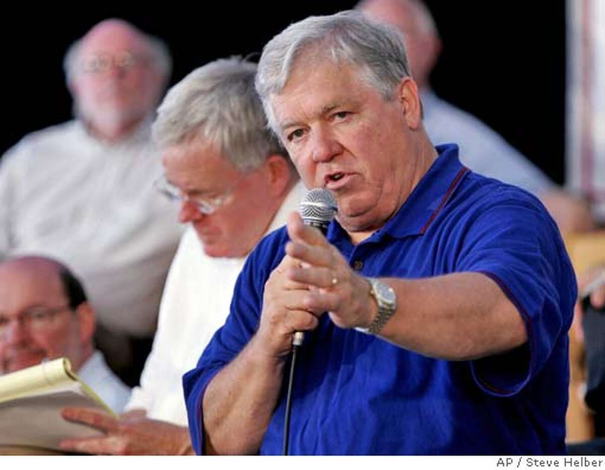Mississippi Gov. Haley Barbour gestures during a town meeting on his Commission on Recovery, Rebuilding and Renewal, along with commission chairman Jim Barksdale, left, in Gulfport Miss., Tuesday, Sept. 20, 2005. Barbour met with President Bush earlier in the day to brief him on the rebuilding plans. (AP Photo/Steve Helber)