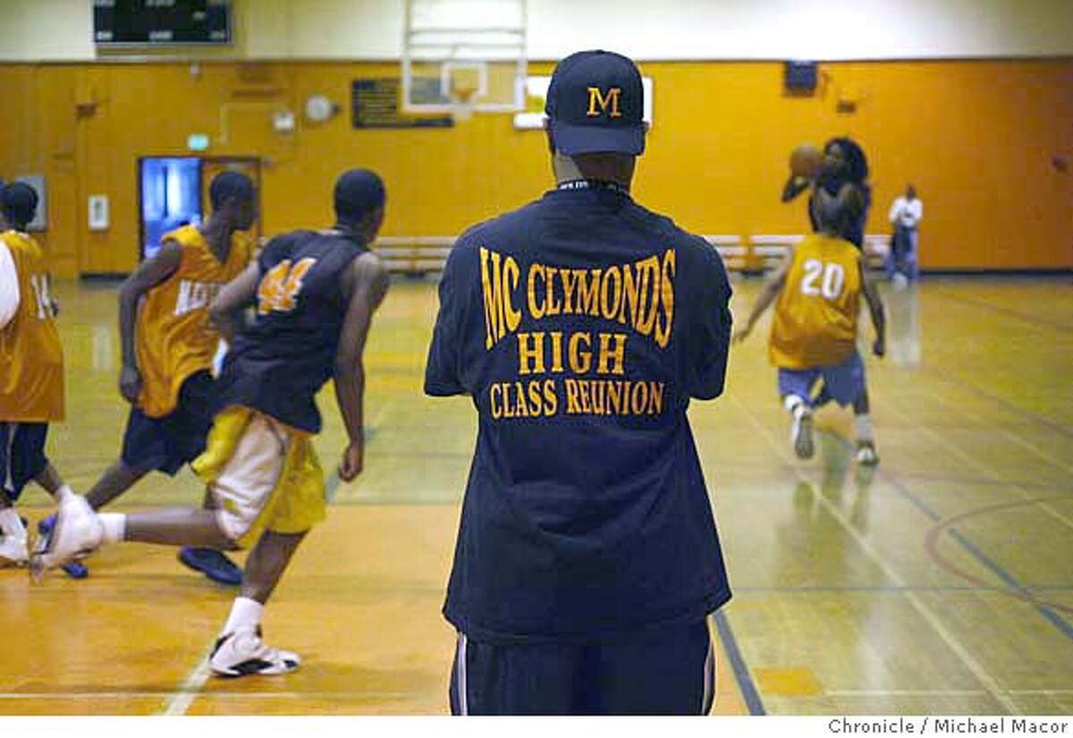 mcclymonds_269_mac.jpg Assistant coach Brandon Brooks is a 1978 alumni of the school. McClymonds High School of Oakland, plays for the state basketball championship against Fairfax High School on Saturday night in Sacramento. Mcclymonds barely hads 400 students, Fairfax has more than 3,000. A contrast of the two school and how different they really are. Photographed in, Oakland, Ca, on 3/22/07. Photo by: Michael Macor/ The Chronicle Ran on: 03-23-2007 Ernest Brooks, an assistant McClymonds coach and former player, watches the team practice as they prepare to face Fairfax High School in the state championship game.