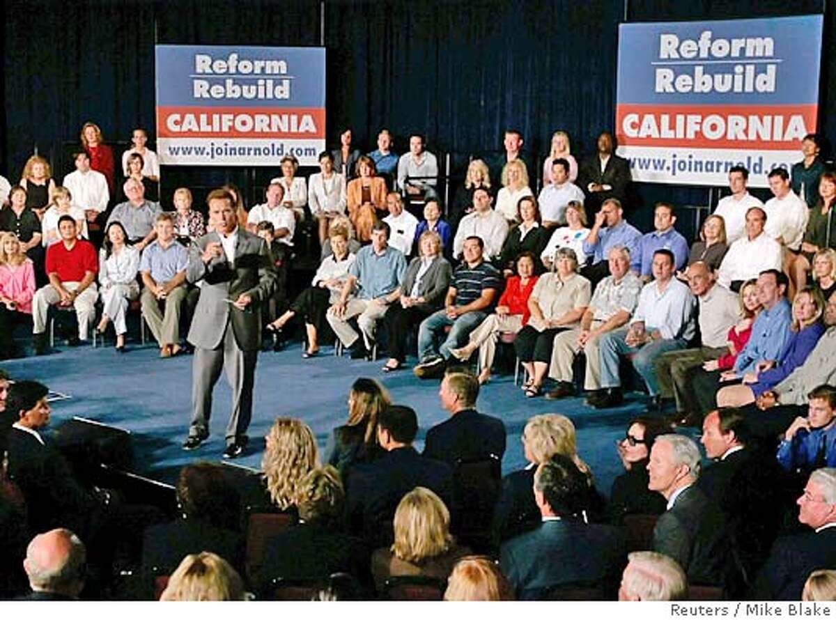 California Governor Arnold Schwarzenegger speaks during a town hall meeting, where he announced he would run for reelection and a second term, in San Diego September 16, 2005. The movie star turned politician became governor after former governor Gray Davis lost a recall campaign to Schwarzenegger in 2003. REUTERS/Mike Blake 0