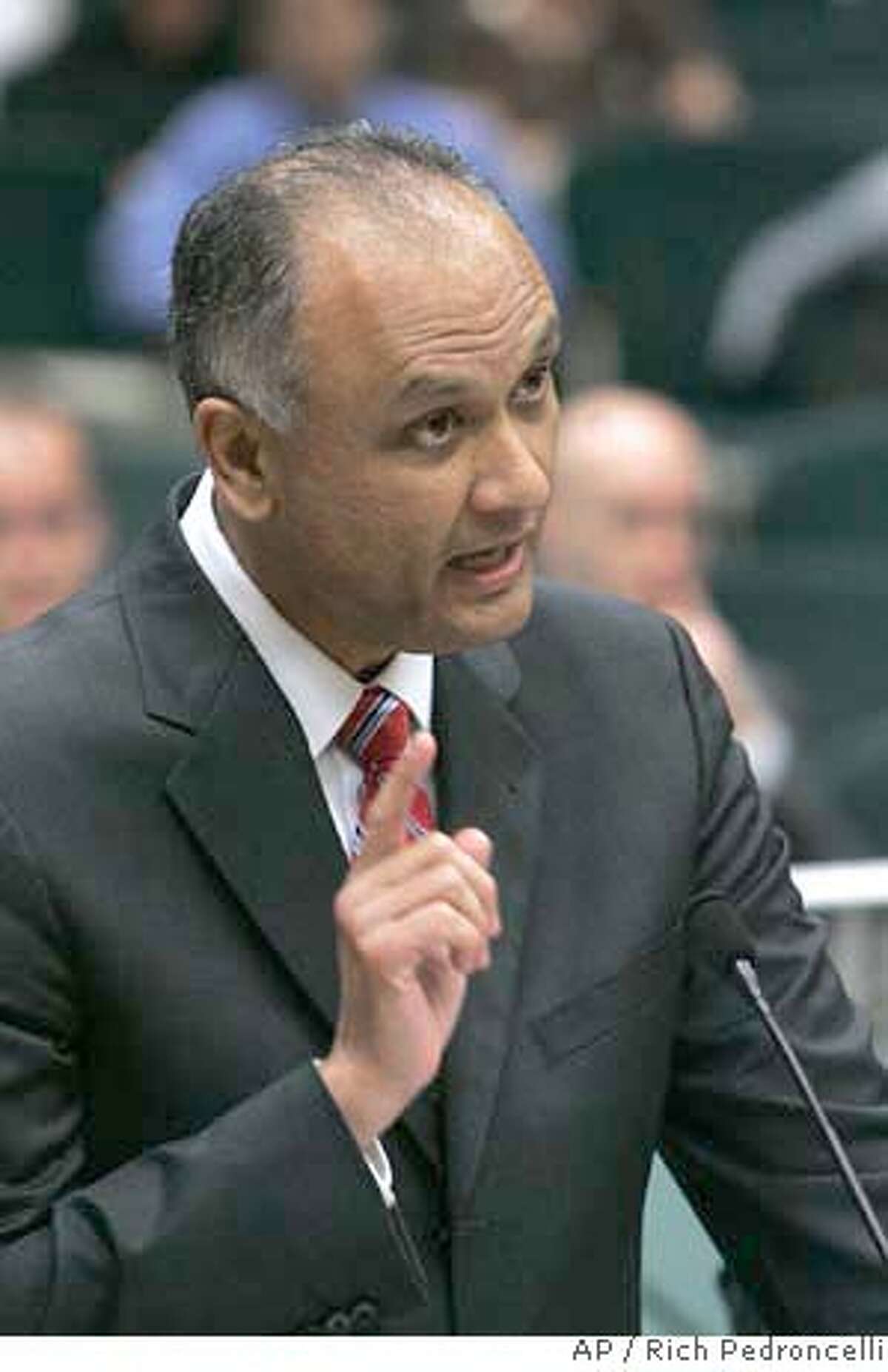 Assemblyman Ed Hernandez, D-Baldwin Park, presents his measure to require girls entering the seventh grade to be vaccinated against the cervical cancer, during a hearing of the Assembly Health Committee at the Capitol in Sacramento, Tuesday, March 13, 2007. After nearly an hour-long debate over the bill, Hernandez was granted a delay in the committee vote until April.(AP Photo/Rich Pedroncelli)