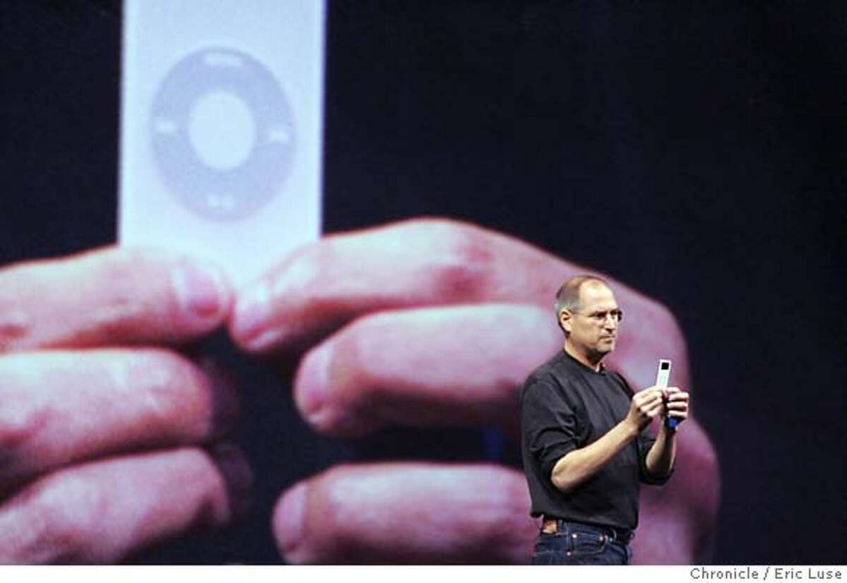 apple08_120_el.JPG Steve Jobs showing how small the new ipod is from from Apple. Apple Computer Inc. plans to make a big announcement at Moscone West about a new iTunes/iPod product, press release says, ""1000 songs in your pocket changed everything. Here we go again.'' The announcement is expected to be a new Motorola cell phone capable of using Apple's iTunes Music program. Cell carrier Cingular may be the first to offer. Event on apple08_120_el.JPG in San Francsico Eric Luse / The Chronicle