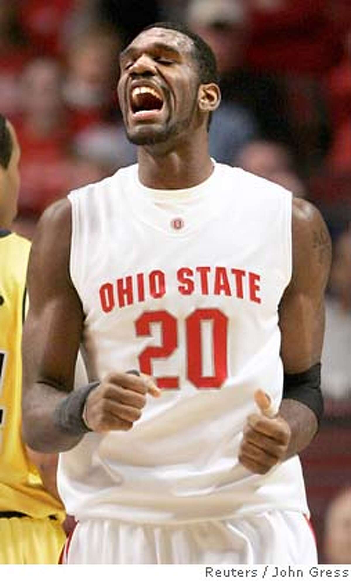 Ohio State University's Greg Oden reacts to making a basket on the University of Michigan during the Big Ten Men's Basketball Tournament NCAA game in Chicago, March 9, 2007. REUTERS/John Gress (UNITED STATES) 0