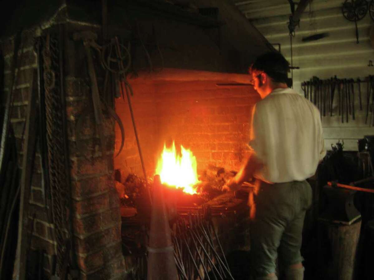 A blacksmith in Colonial Williamsburg.