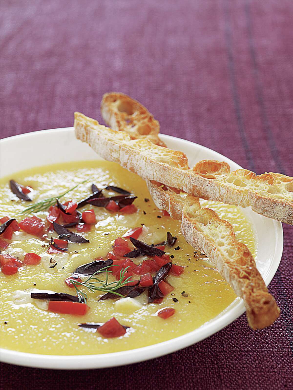 Golden Cauliflower Soup With Goat Cheese, Olives, and Tomato