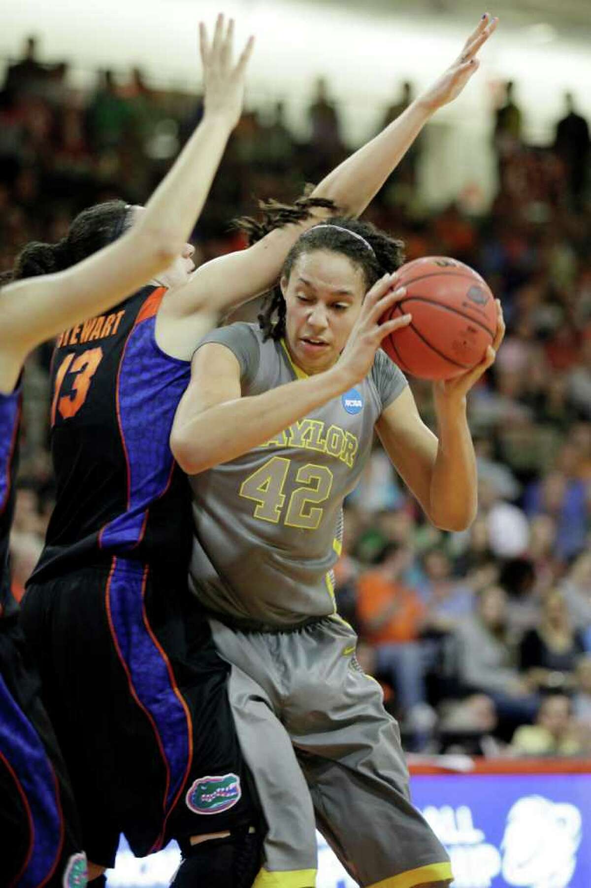 Baylor's Brittney Griner (42) makes a move in the lane against Florida's Azania Stewart (13) during the first half of a second-round NCAA women's tournament college basketball game, Tuesday, March 20, 2012, in Bowling Green, Ohio. (AP Photo/J.D. Pooley)