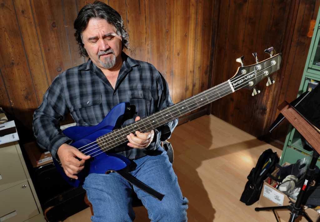 Trumbull Luthier Invents Sit down Bass Guitar