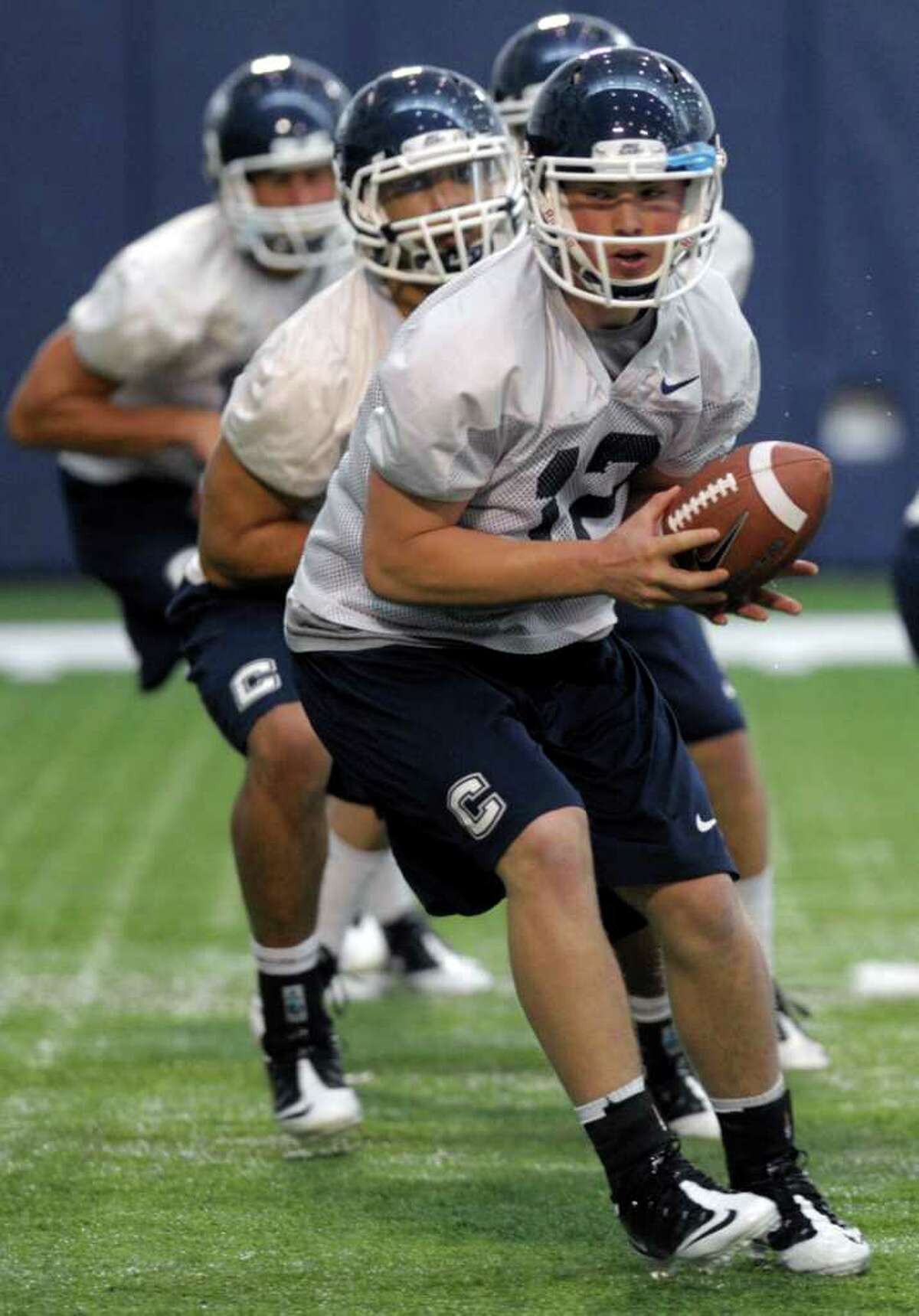 Connecticut quarterback Casey Cochran (12) runs a drill during the first day of the team's spring NCAA college football practice, Tuesday, March 20, 2012, in Storrs, Conn. (AP Photo/Sean D. Elliot,The Day) MANDATORY CREDIT: SEAN D. ELLIOT/THE DAY