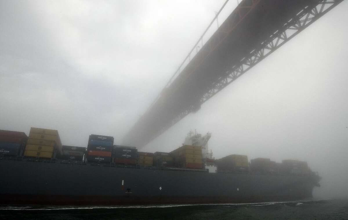 The MSC Fabiola moves under the Golden Gate Bridge in heavy fog. The Fabiola, the largest container ship to ever visit San Francisco Bay, arrived Wednesday, March 21, 2012. The Fabiola has the capacity to carry 12,500 containers, about one third more than the ships that normally visit the Bay.